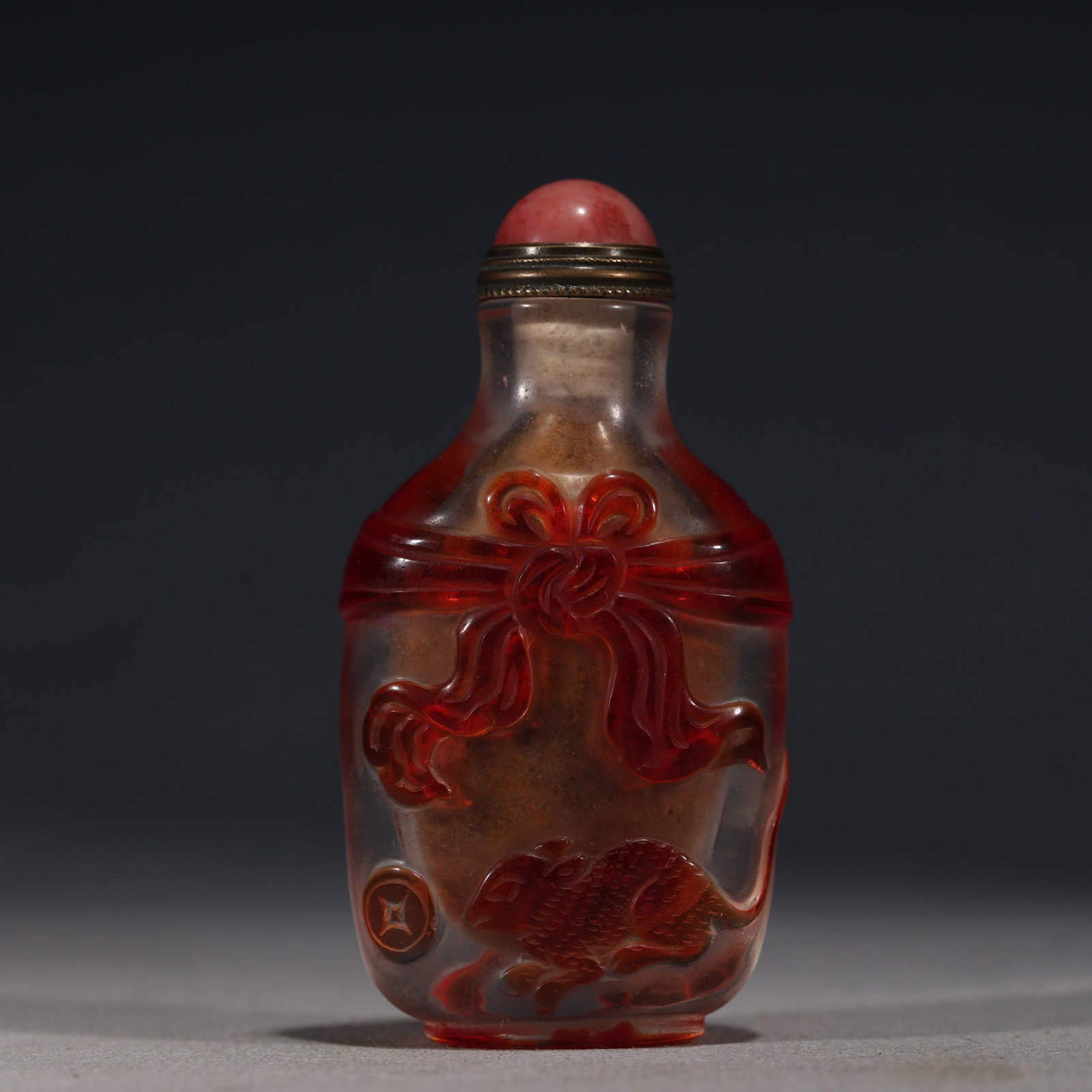 An Exquisite Overlaid Red Glass Snuff Bottle With Coin And Rabbit Pattern (1 of 5)