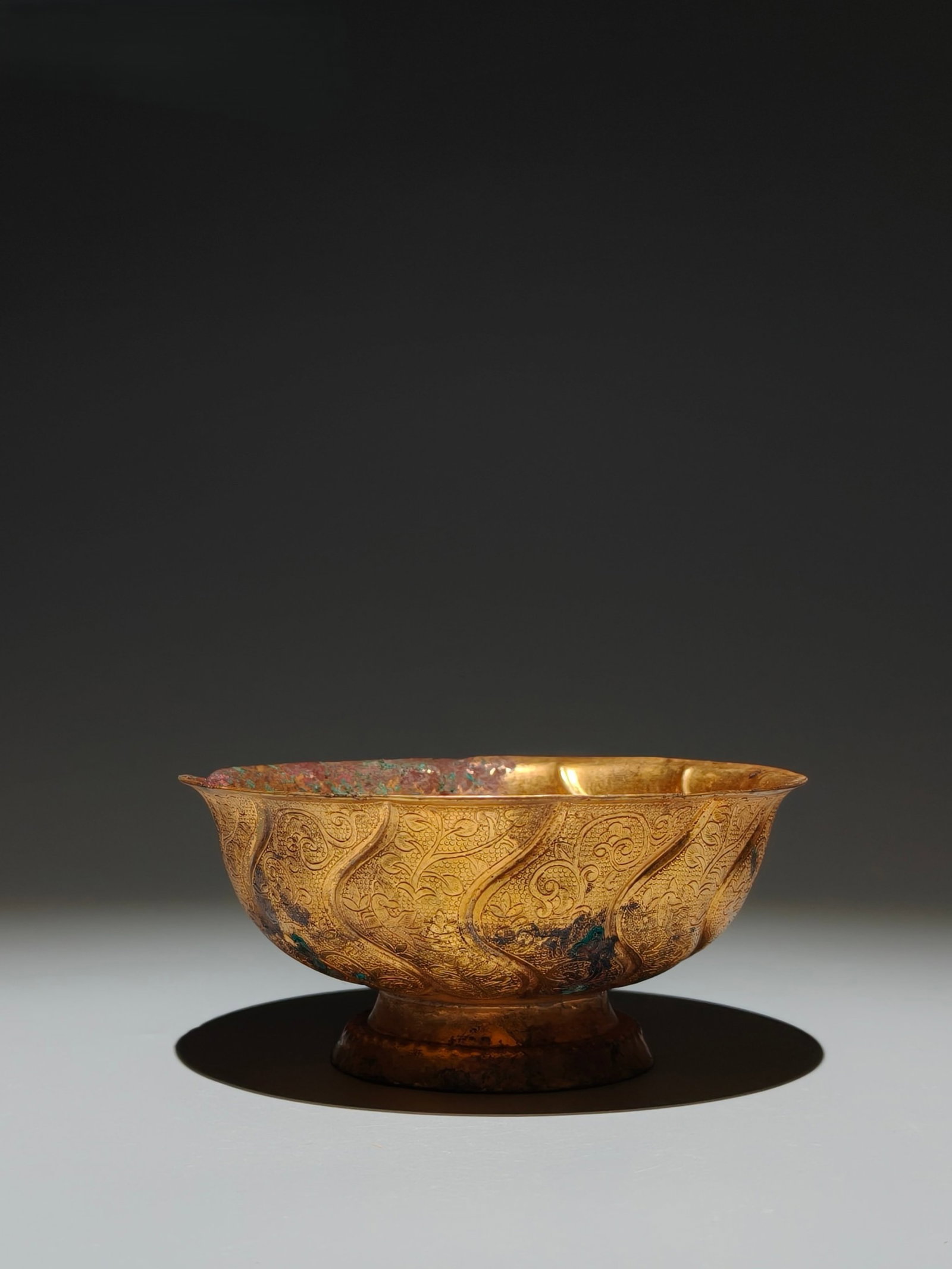 An Exquisite Bronze Glass-plated Gold Flower and Bird Pattern Bowl: An Exquisite Bronze Glass-plated Gold Flower and Bird Pattern Bowl,Tang Dynasty,China,With Mark,Size:2.4inx5.1in 铜镀金花鸟纹碗,中国唐ߣ