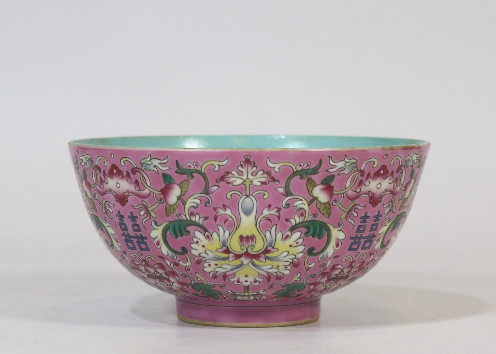 A fine rouge-pink ground famille rose double happiness bowl with scrolling floral pattern: A fine rouge-pink ground famille rose double happiness bowl with scrolling floral pattern, Qing Dynasty, China, with six-character Jiaqing reign mark, Size:3inx6.1in 胭脂水粉&#