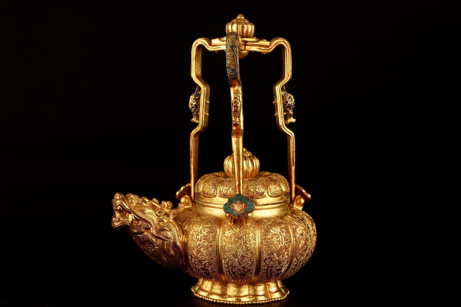 An Exquisite Gilt Bronze Lotus Pattern Loop-Handled Pot: An Exquisite Gilt Bronze Lotus Pattern Loop-Handled Pot,Qing Dynasty,China,Qianlong Four-character Mark,Size:9.1inx6.7in,Weight:722g 铜鎏金缠枝莲纹提
