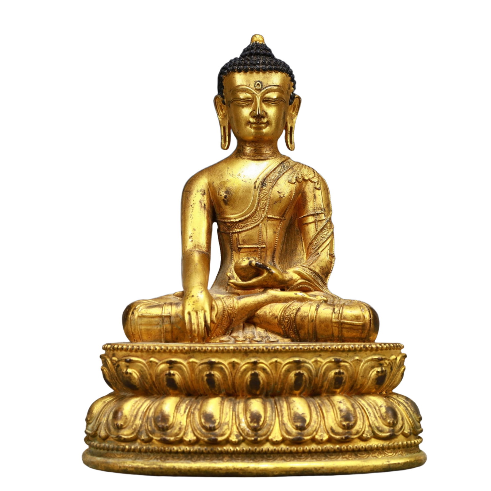 A Solemn Gilt Bronze Statue of Sakyamuni: A Solemn Gilt Bronze Statue of Sakyamuni,Ming Dynasty, China,Size:5.7inx3.5inx8.3in,Weight:1600g 铜鎏金释迦摩尼像,中国明代