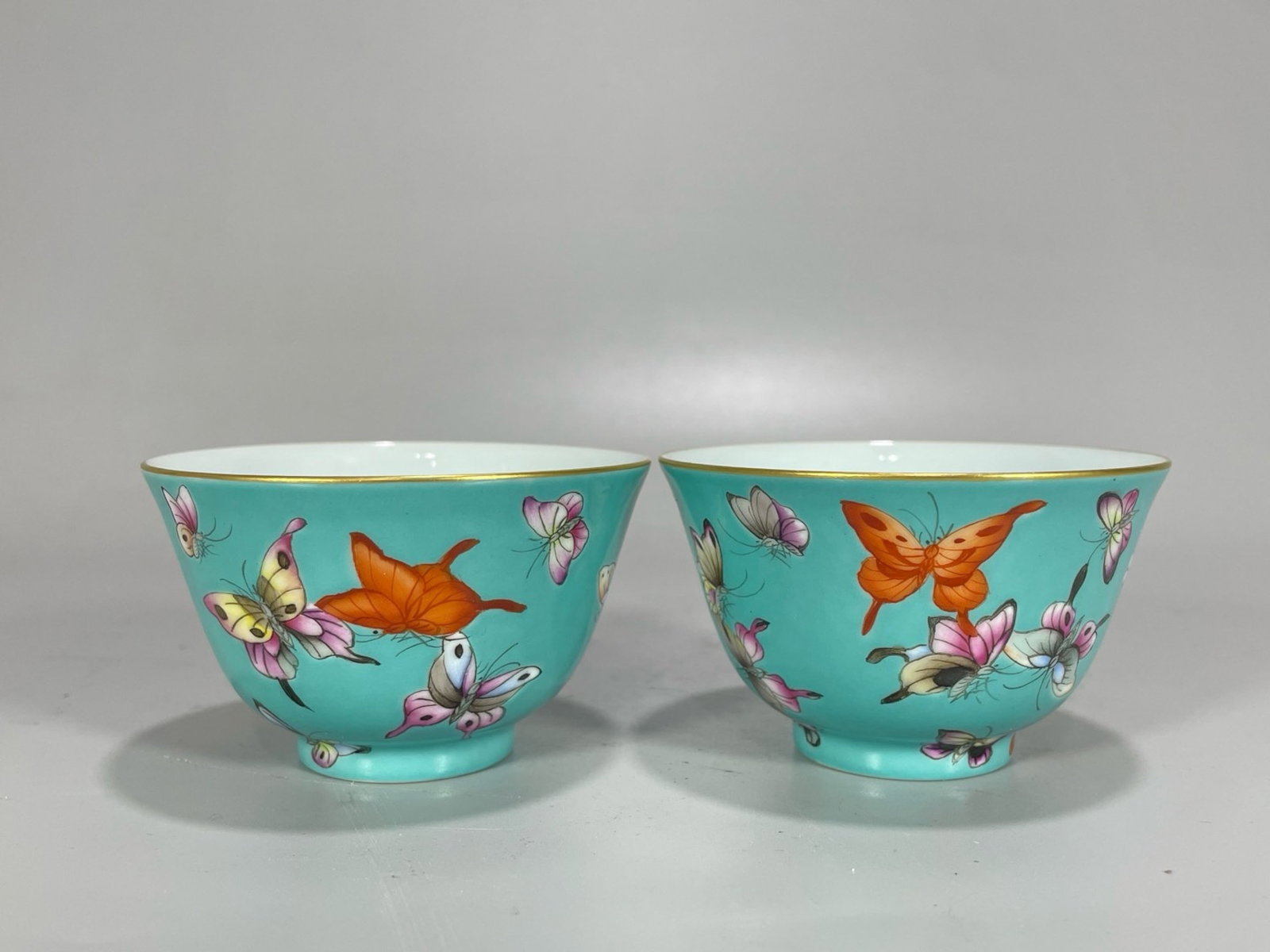 A Pair of Exquisite Turquoise Glazed Famille-Rose Painted Gold Butterfly Pattern Cups: A Pair of Exquisite Turquoise Glazed Famille-Rose Painted Gold Butterfly Pattern Cups,Qing Dynasty,China,Yongzheng Four-character Mark,Size:1.9inx3in