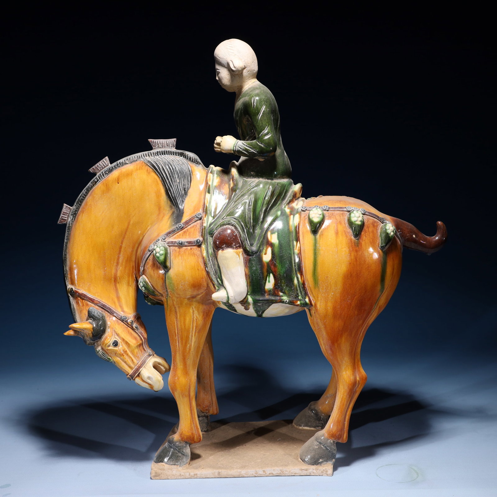 An Rare Tang Tri-Color Glazed Pottery Figure Riding Horse Ornament: An Rare Tang Tri-Color Glazed Pottery Figure Riding Horse Ornament,Tang Dynasty,China,Size:21.3inx6.7inx22.4in,Weight:8450g 唐三彩人物骑马摆件,