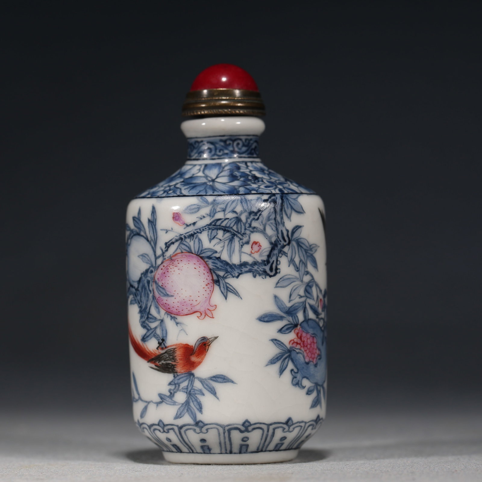 An Exquisite Blue and White with Colored Enamel Pomegranate Ribbon Bird Pattern Snuff Bottle: An Exquisite Blue and White with Colored Enamel Pomegranate Ribbon Bird Pattern Snuff Bottle,Qing Dynasty, China,Kangxi Four-character Mark,Size:1.6in×1.6in×3.1in 青花加