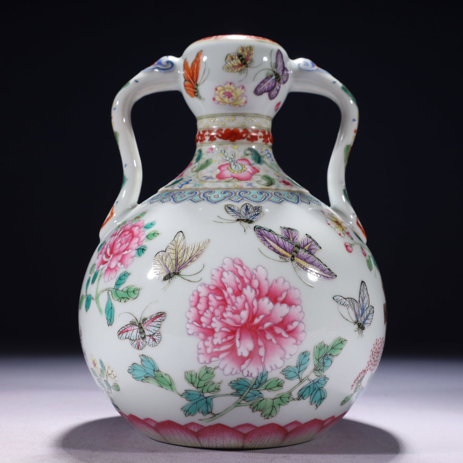 An Exquisite Famille-Rose Flower and Butterfly Pattern Double-Ears Vase: An Exquisite Famille-Rose Flower and Butterfly Pattern Double-Ears Vase,Qing Dynasty,China,Yongzheng Six-character Mark,Size:6.3inx8.7in,Weight:1250g