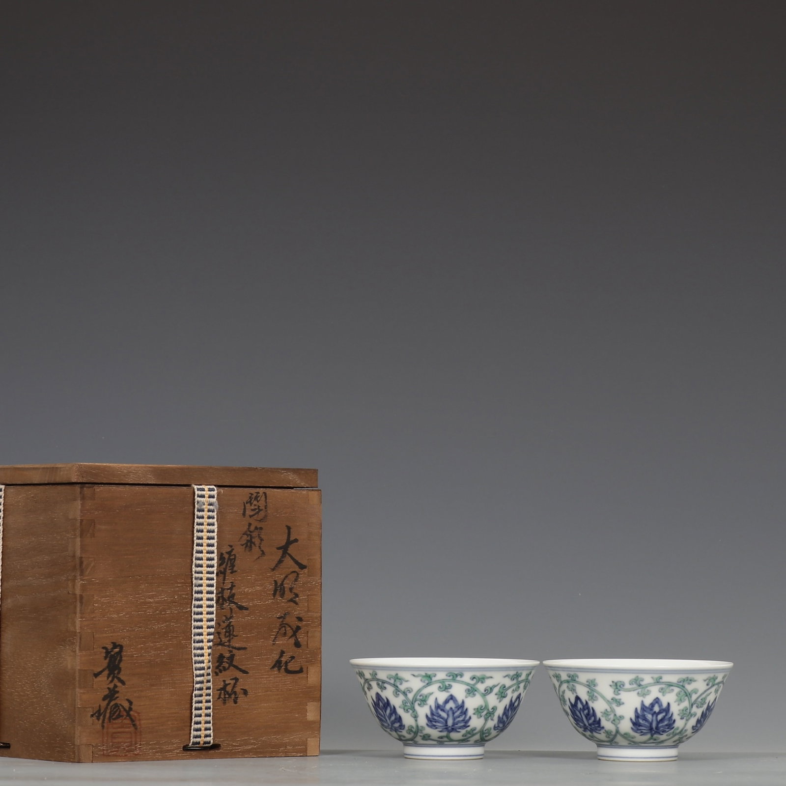 A Pair of Exquisite Doucai Lotus Pattern Cups: A Pair of Exquisite Doucai Lotus Pattern Cups,Ming Dynasty,China,Chenghua Six-character Mark,Size:1.8inx3.5in