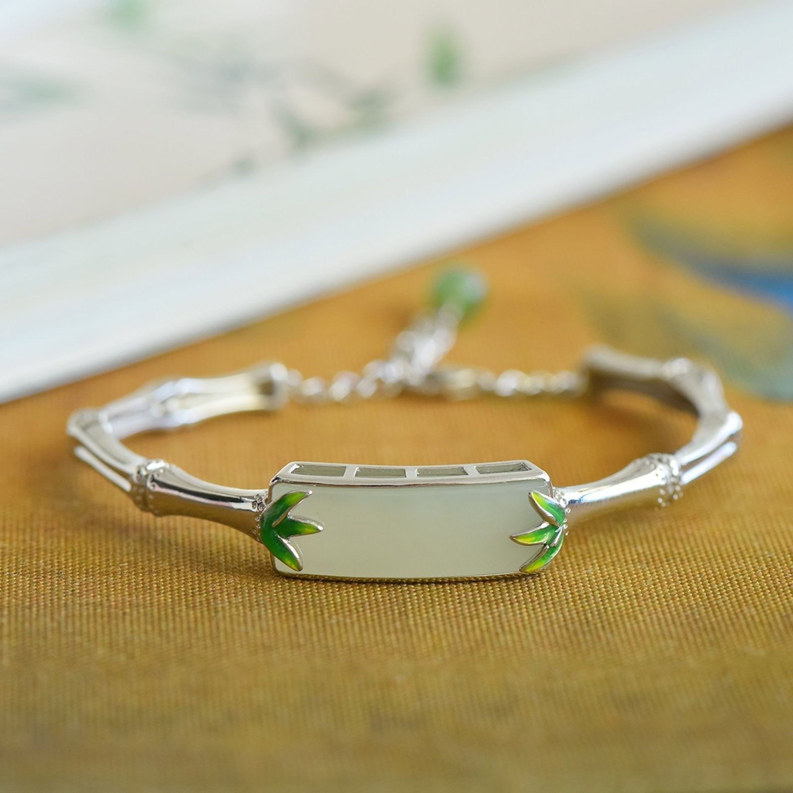 An Exquisite Sterling Silver Inlaid White Jade Enamel Bracelets: An Exquisite Sterling Silver Inlaid White Jade Enamel Bracelets 纯银镶白玉珐琅手镯