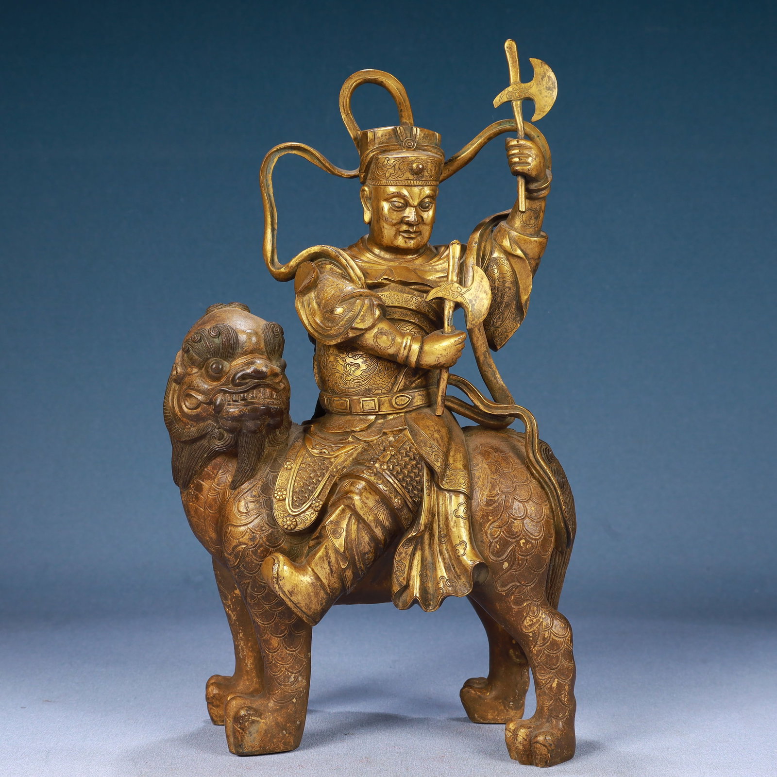 A Solemn Gilt Bronze Statue of Dharma Protector Rides the Lion: A Solemn Gilt Bronze Statue of Dharma Protector Rides the Lion,Qing Dynasty, China,Size:7.1inx4.3inx13in,Weight:5300g 铜鎏金骑狮护法像,中国&