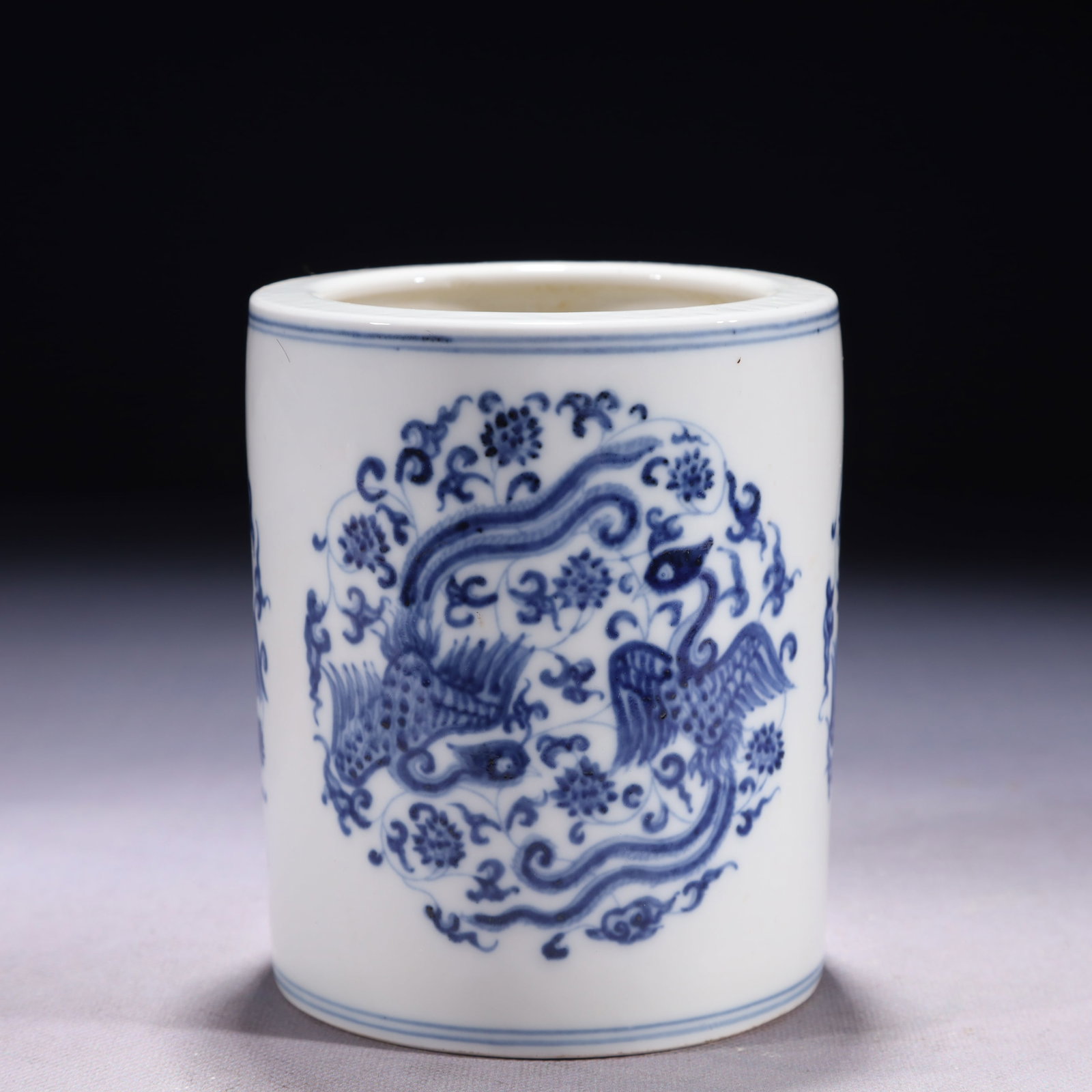 An Exquisite Blue and White Lotus and Phoenix Pattern Brush Pot: An Exquisite Blue and White Lotus and Phoenix Pattern Brush Pot,Ming Dynasty,China,Xuande Six-character Mark,Size:4.1inx5.3in,Weight:600g