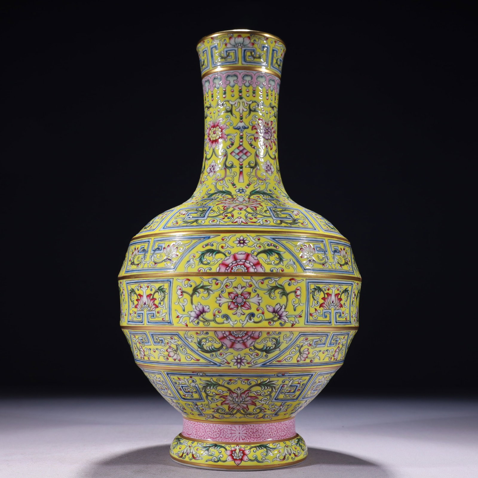 An Exquisite Yellow Ground Famille-Rose Painted Gold Lotus Pattern Vase: An Exquisite Yellow Ground Famille-Rose Painted Gold Lotus Pattern Vase,Qing Dynasty,China,Qianlong Six-character Mark,Size:6.7inx13.4in,Weight:2350g 黄地粉彩描金&#