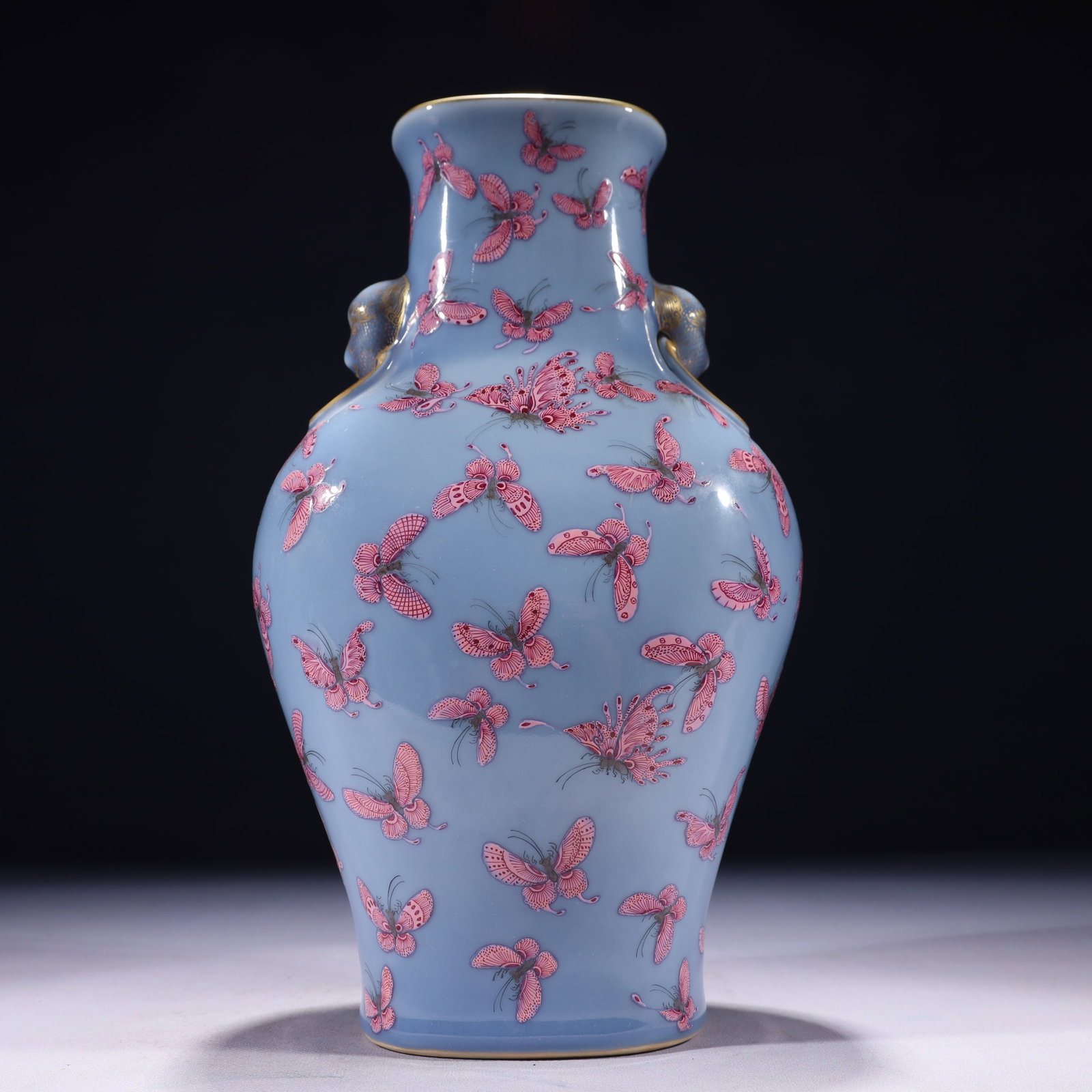 An Exquisite Blue Ground Famille-Rose Painted Gold Butterfly Pattern Beast-Ears Vase: An Exquisite Blue Ground Famille-Rose Painted Gold Butterfly Pattern Beast-Ears Vase 蓝地粉彩描金蝴蝶纹兽耳瓶,中国&#