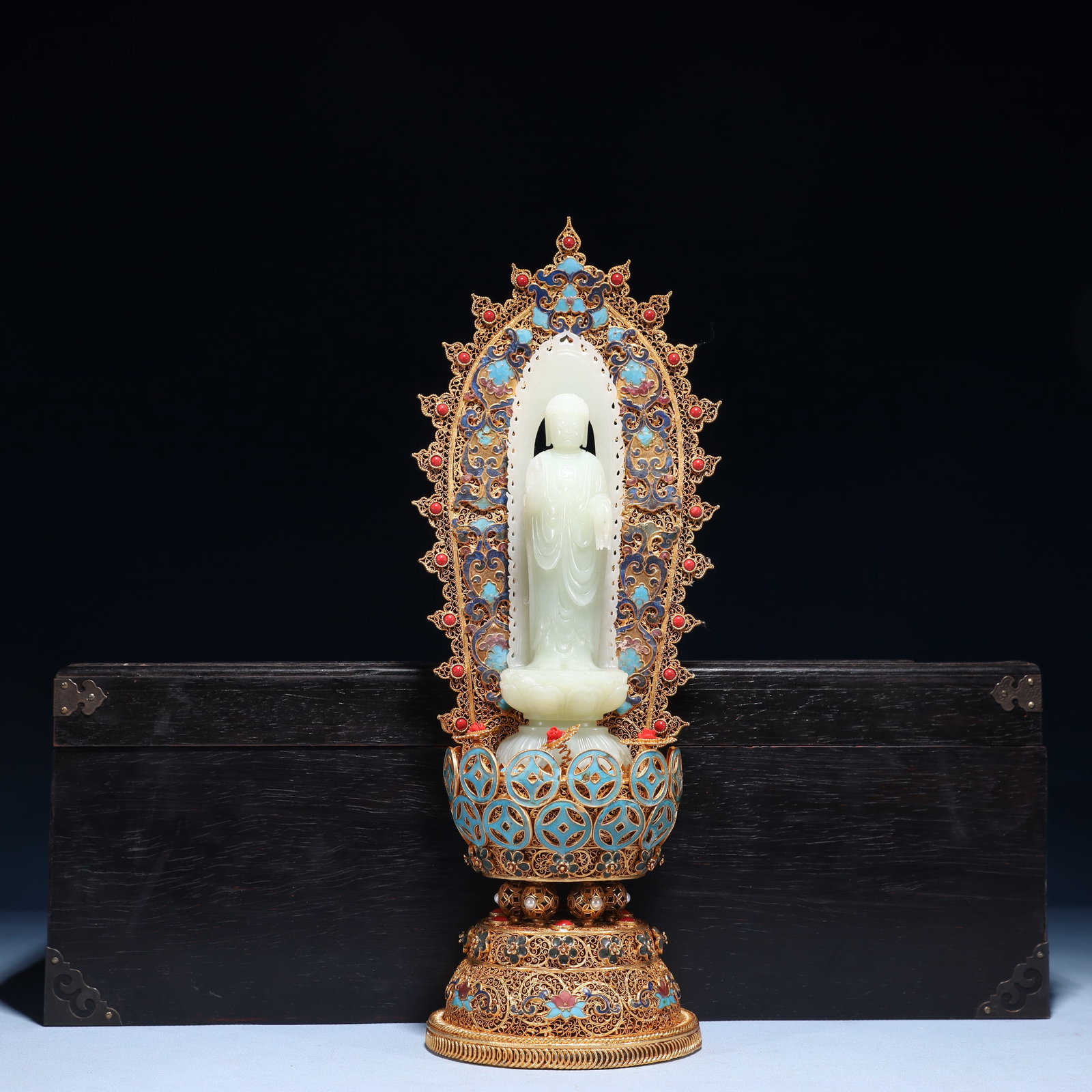 An Exquisite Filigree and Gilding Inlaid White Jade Buddha Statue, Inlaid Gems: An Exquisite Filigree and Gilding Inlaid White Jade Buddha Statue, Inlaid Gems, Qing Dynasty,China, Qianlong Four-character Mark, Size:5.5inx14.6in,(Box)18.1inx9.1inx6.7in,Weight:1200 花丝