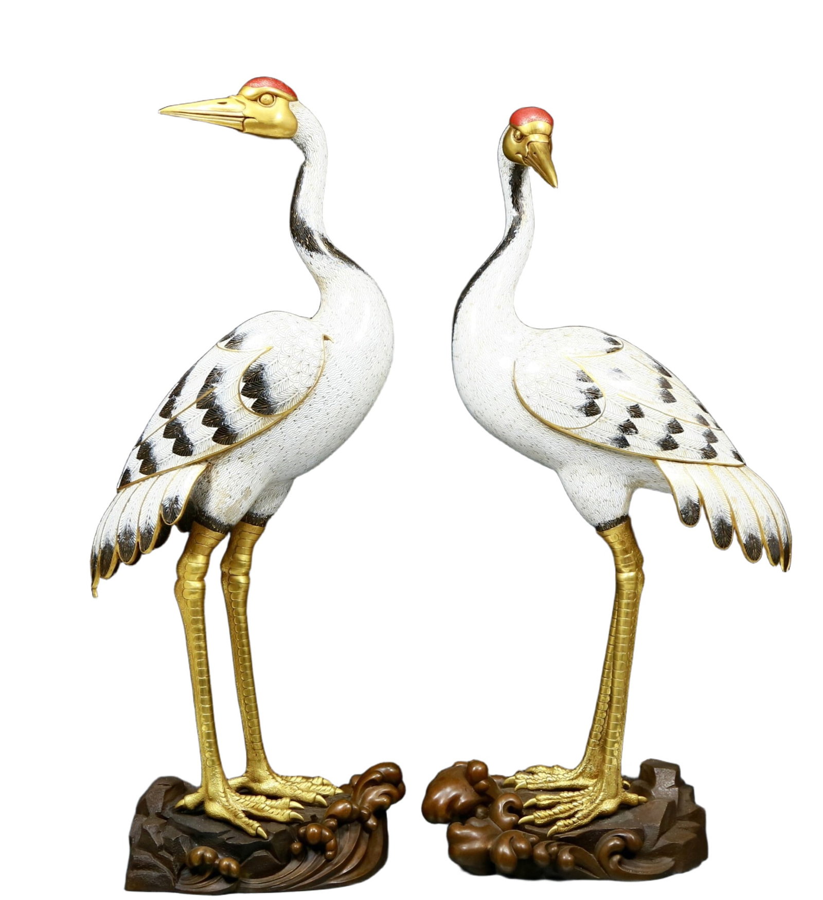 A Gorgeous Pair Of Cloisonne Cranes: A Gorgeous Pair Of Cloisonne Cranes. Each is modeled in the form of a standing crane, body enameled with white with gilt wire cloisonné and stripes of black plumage, the head turned to the side, 