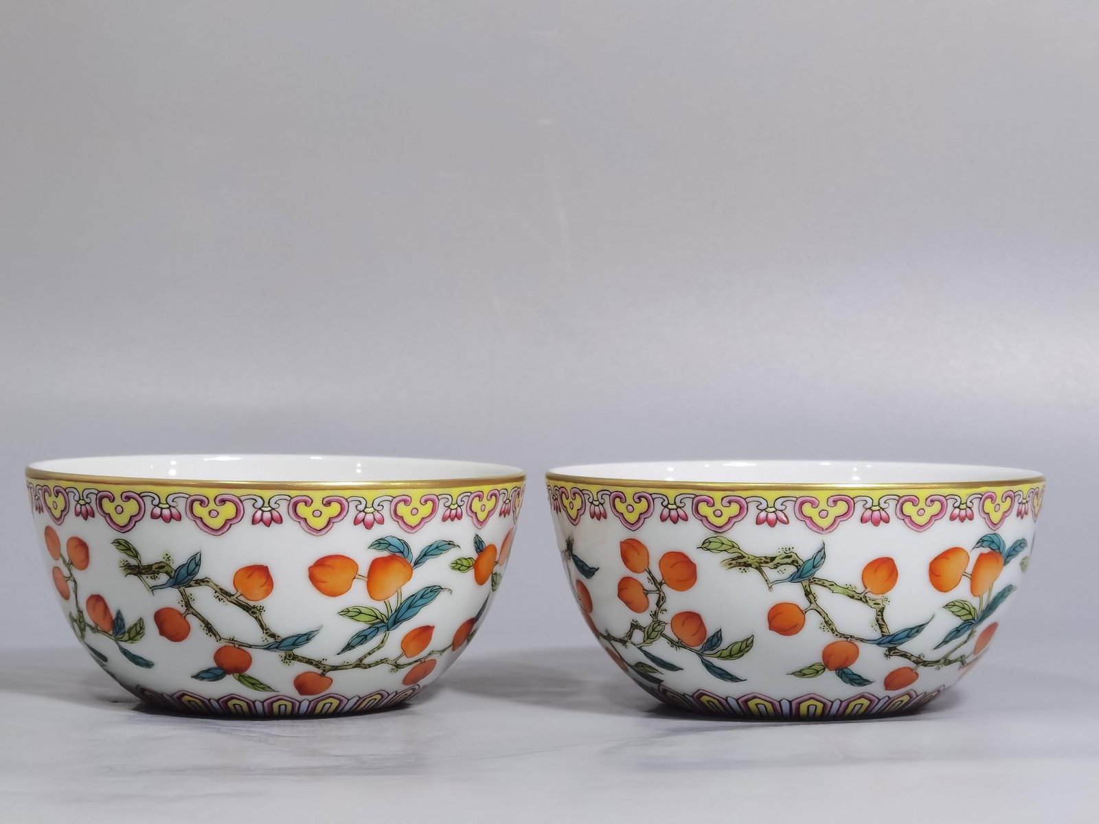 A Pair of Exquisite Famille-Rose Painted Gold Cherry Pattern Cups: A Pair of Exquisite Famille-Rose Painted Gold Cherry Pattern Cups,Qing Dynasty,China,Yongzheng Six-character Mark,Size:3.7inx1.7in