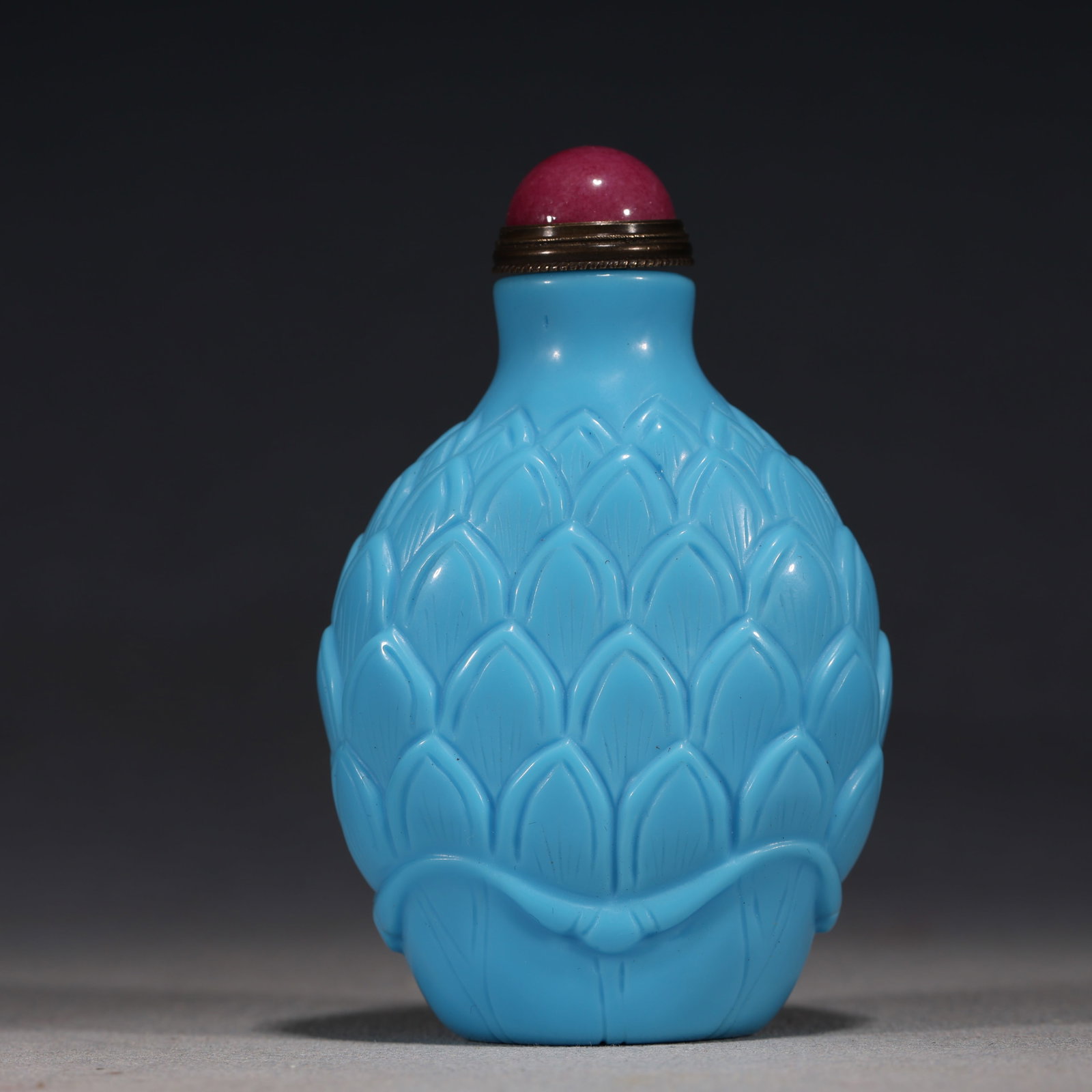 An Exquisite Sky-blue Glass Relief Lotus Petal Pattern Snuff Bottle: An Exquisite Sky-blue Glass Relief Lotus Petal Pattern Snuff Bottle,Qing Dynasty, China,Size:2in×1.2in×3.1in 天蓝琉璃浮雕莲瓣纹鼻&