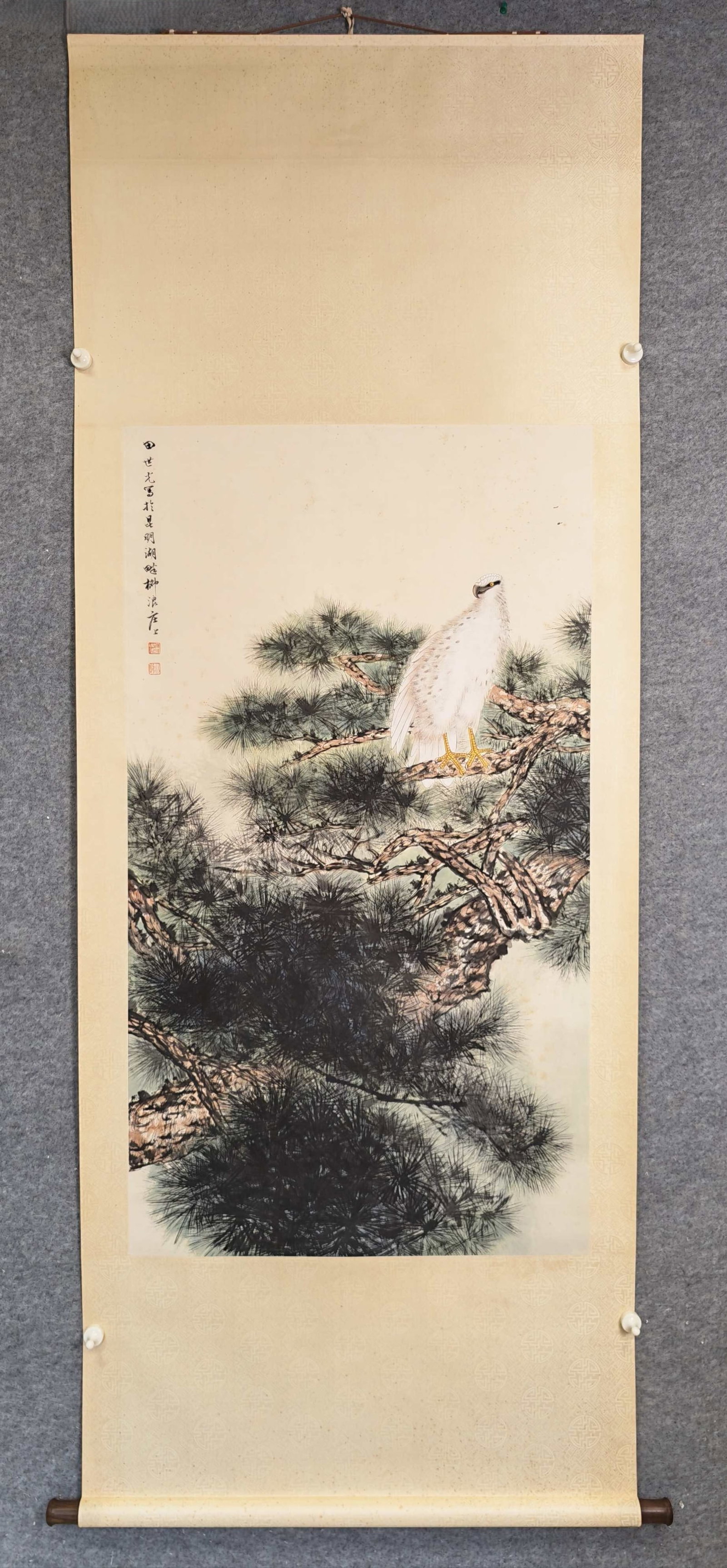A Chinese Vertical Scroll Ink Painting of Pine and Eagle on Paper: A Chinese Vertical Scroll Ink Painting of Pine and Eagle on Paper,Tian Shiguang,Size:26.8inx53.9in 一幅中国水墨松鹰画立轴,田