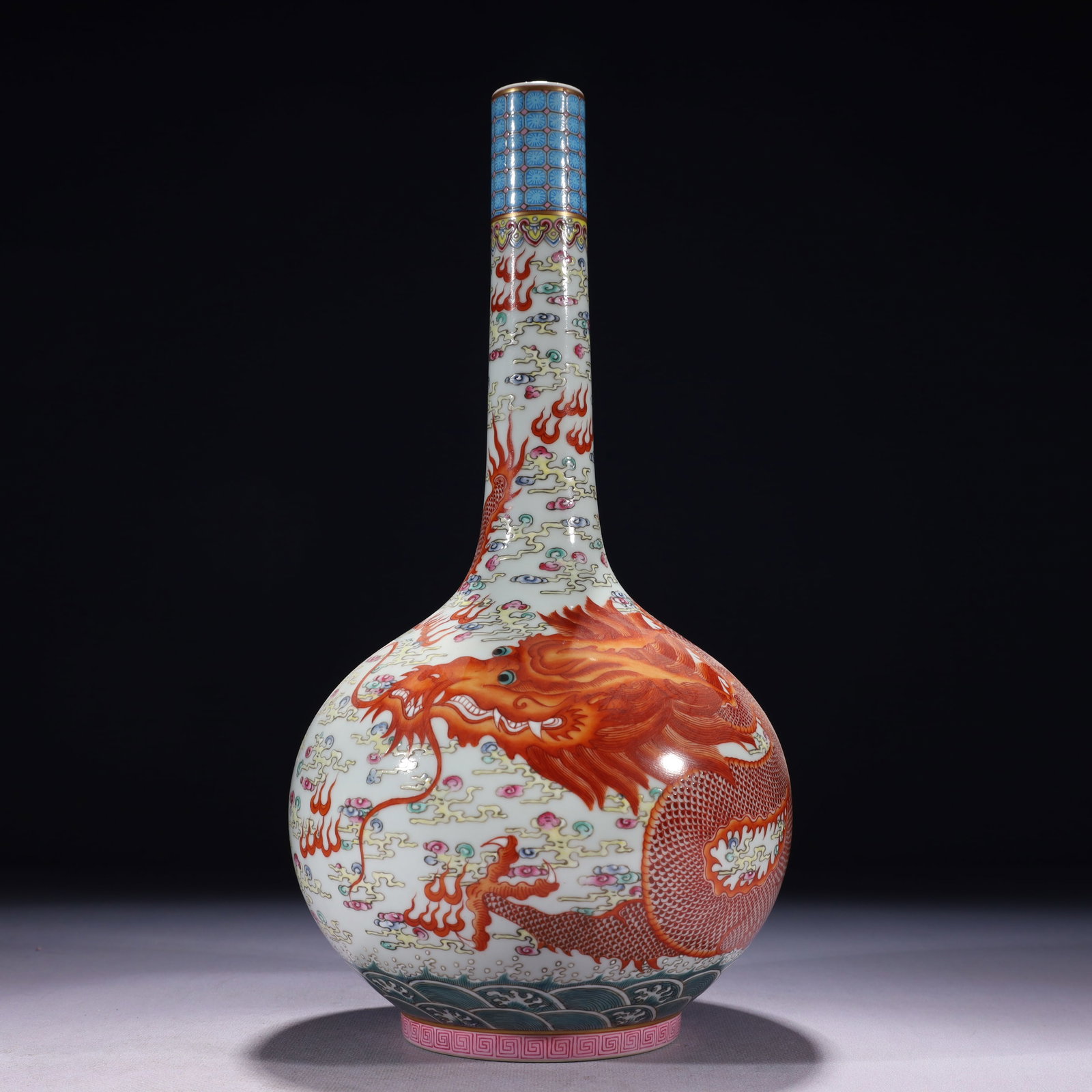 An Exquisite Famille-Rose Iron-Red Painted Gold Auspicious Cloud and Dragon Pattern Vase: An Exquisite Famille-Rose Iron-Red Painted Gold Auspicious Cloud and Dragon Pattern Vase,Qing Dynasty,China,Yongzheng Six-character Mark,Size:6.3inx13.8in,Weight:1300g