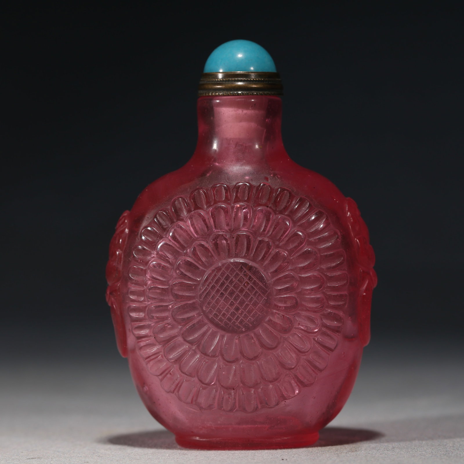 An Exquisite Pink Glass Interlocking Lotus Pattern Snuff Bottle: An Exquisite Pink Glass Interlocking Lotus Pattern Snuff Bottle,Qing Dynasty, China,Qianlong Four-character Mark,Size:2in×1in×3.1in