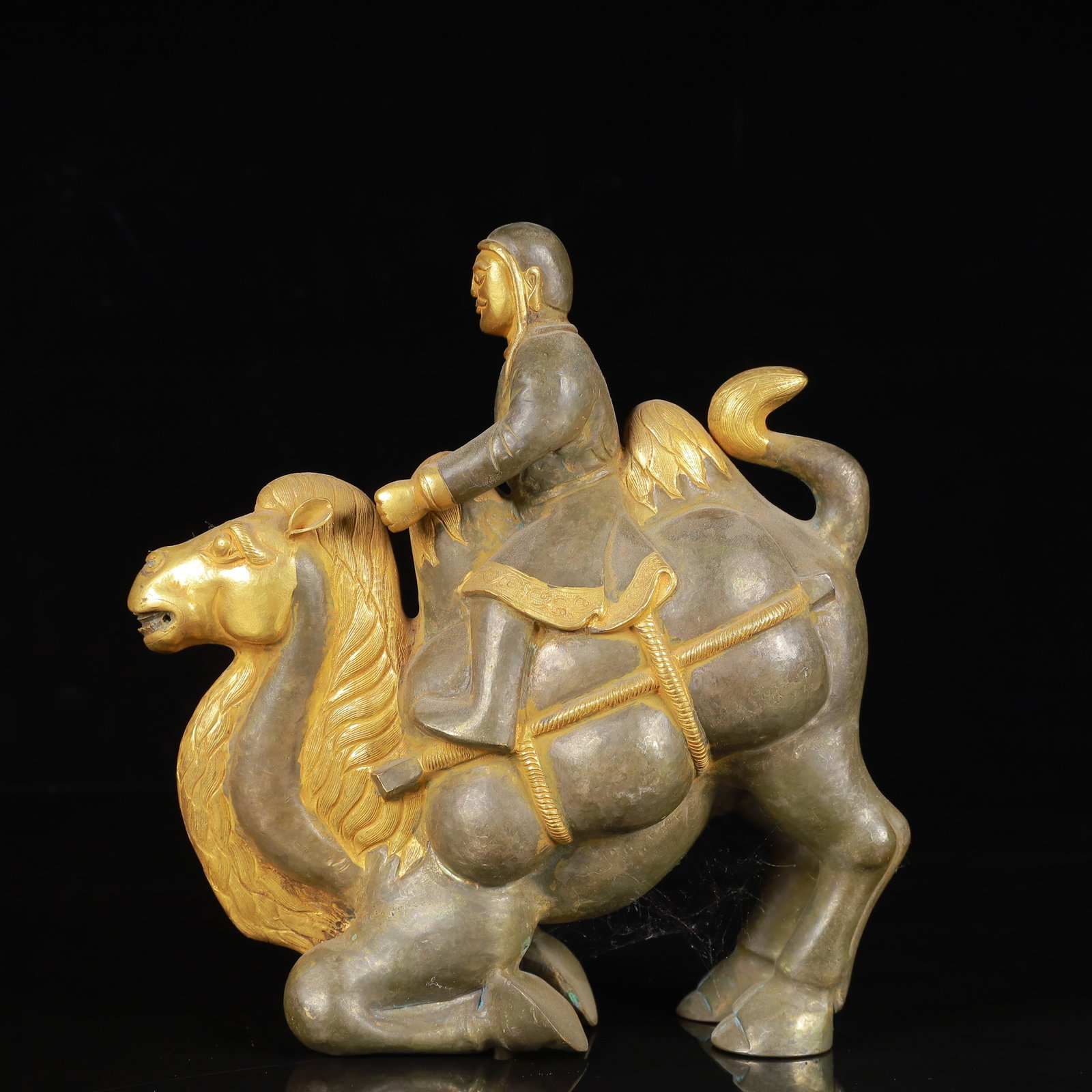 An Exquisite Gilt Silver Figure Riding Camel Ornament: An Exquisite Gilt Silver Figure Riding Camel Ornament,Qing Dynasty,China,Size:7.1inx2.8inx7.9in,Weight:850g