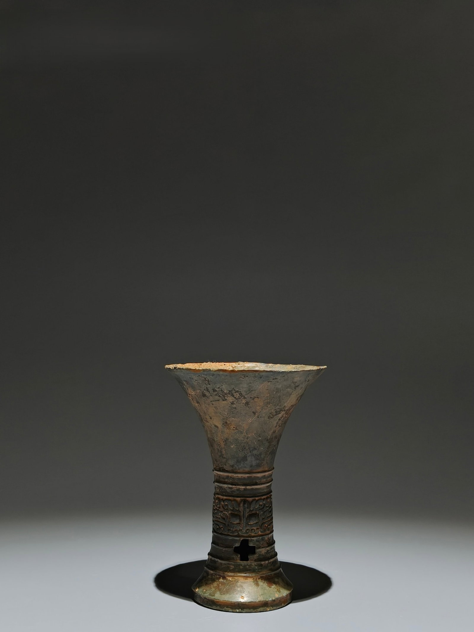 An Archaic Bronze Beast-Face Pattern Gu: An Archaic Bronze Beast-Face Pattern Gu,Shang Dynasty,China,Size:5.5inx3.7in 青铜兽面纹觚,中国商代