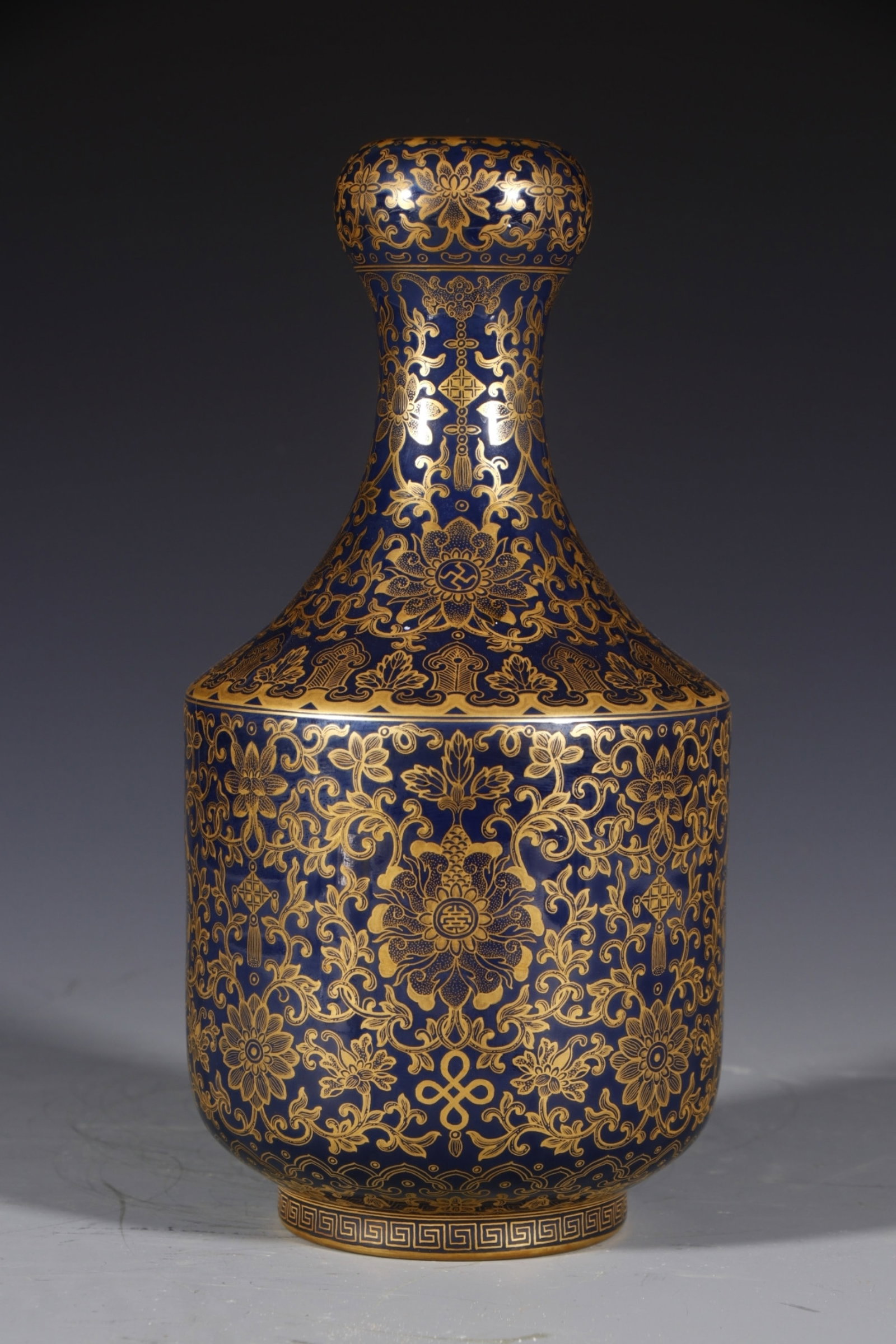 An Exquisite Ji Blue Glazed Painted Gold Lotus Pattern Vase: An Exquisite Ji Blue Glazed Painted Gold Lotus Pattern Vase,Qing Dynasty,China,Qianlong Six-character Mark,Size:11inx3.5in 霁蓝釉描金缠枝莲纹ī