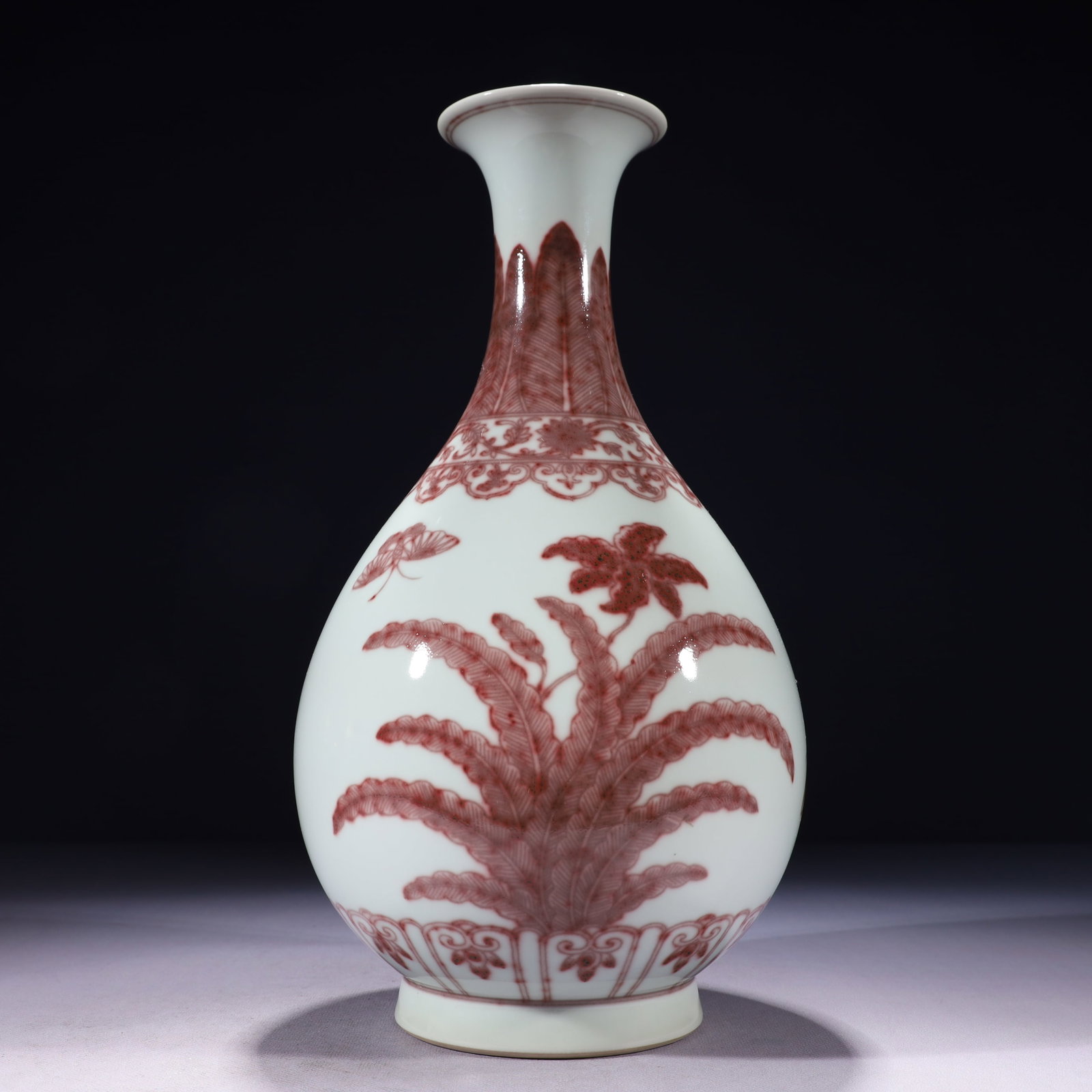 An Exquisite Underglaze-Red Banana Leaf Pattern Vase: An Exquisite Underglaze-Red Banana Leaf Pattern Vase,Qing Dynasty,China,Qianlong Six-character Mark,Size:6.3inx13.8in,Weight:1950g 釉里红芭蕉叶纹瓶,