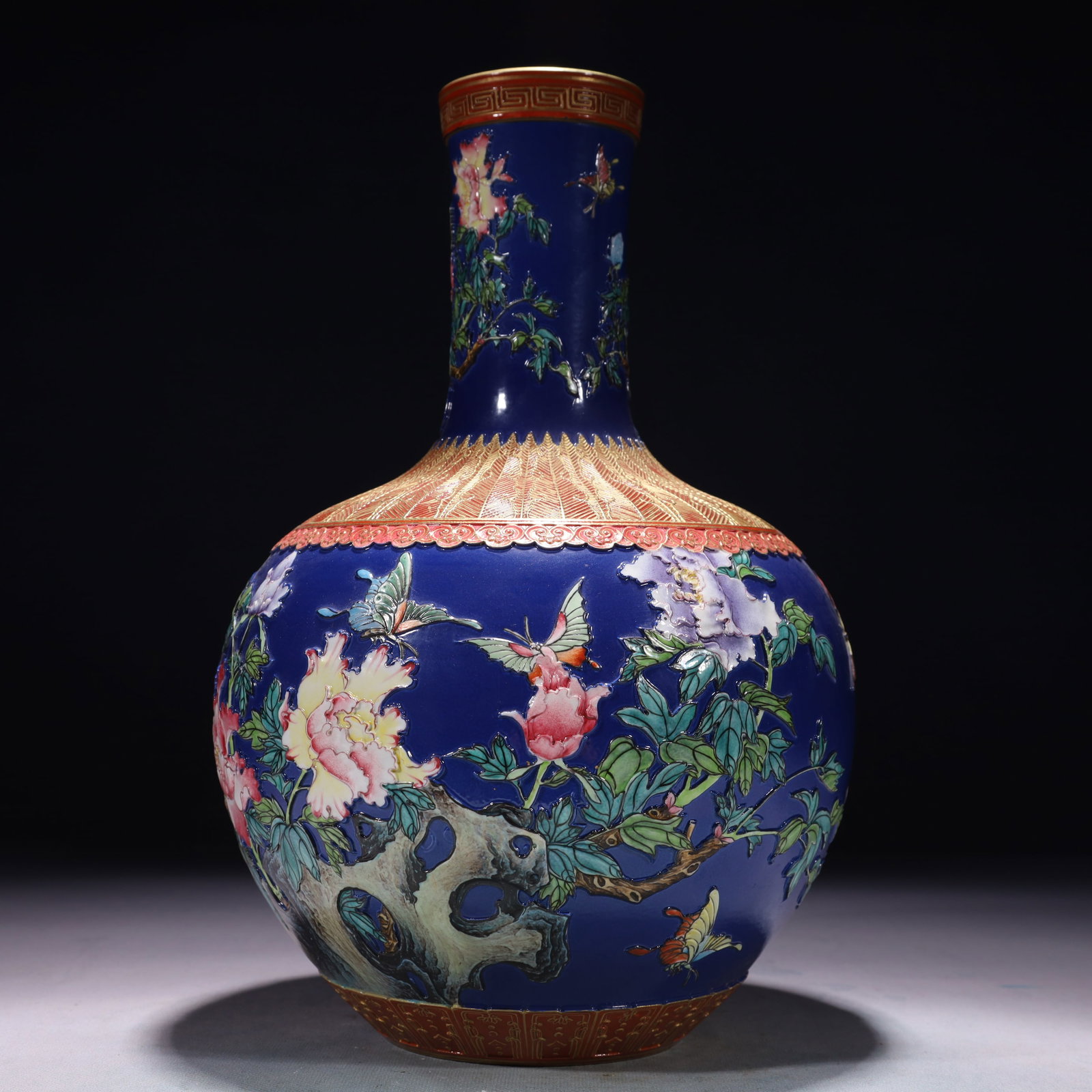 An Exquisite Blue Ground Famille-Rose Painted Gold Flower and Butterfly Pattern Vase: An Exquisite Blue Ground Famille-Rose Painted Gold Flower and Butterfly Pattern Vase,Qing Dynasty,China,Qianlong Six-character Mark,Size:7.9inx13in,Weight:2700g 蓝地粉彩描