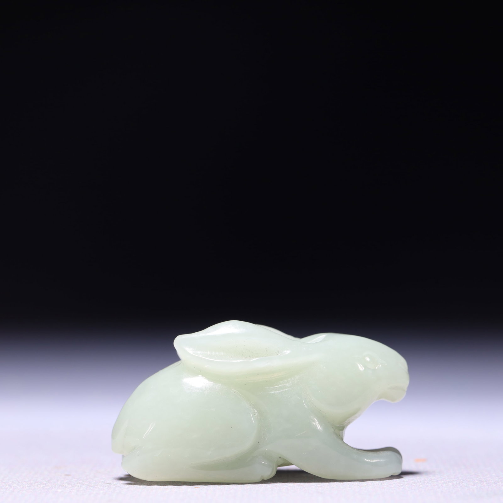 An Exquisite White Jade Rabbit Ornament: An Exquisite White Jade Rabbit Ornament,Qing Dynasty,China,Size:1.8inx0.6inx0.8in,Weight:35g 白玉兔子摆件,中国清代