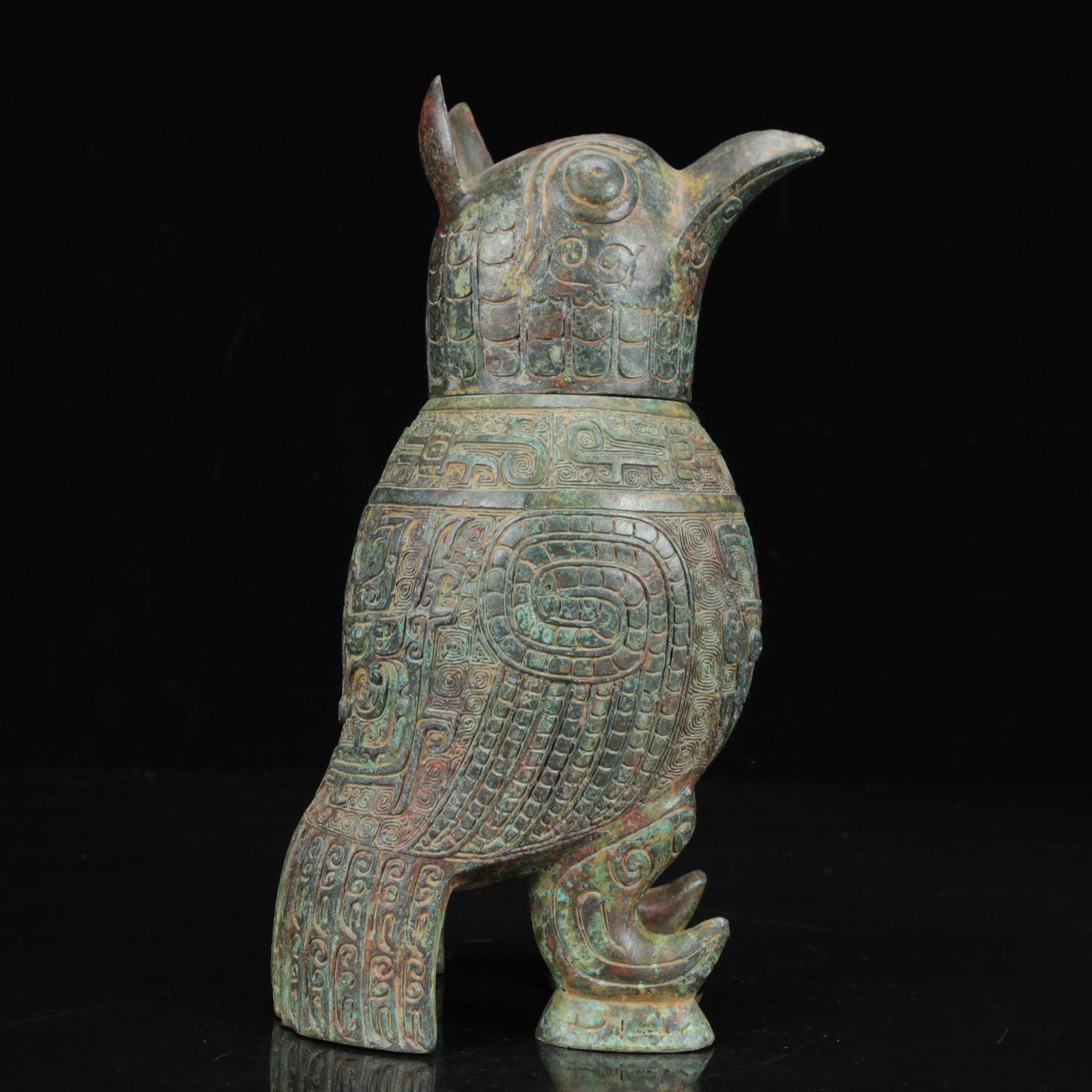 An Archaic Bronze Beast-Face Pattern Bird Ornament: An Archaic Bronze Beast-Face Pattern Bird Ornament,the Warring States Period in China,Size:4.7inx3.5inx10.2in,Weight:2200g 青铜兽面纹鸟摆件,中