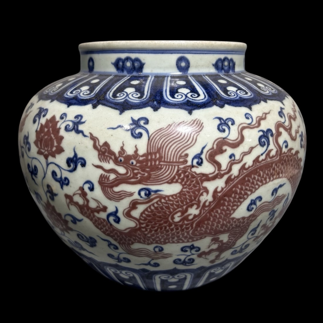 An Exquisite Blue and White Underglaze-Red Lotus and Dragon Pattern Jar: An Exquisite Blue and White Underglaze-Red Lotus and Dragon Pattern Jar,Qing Dynasty,China,Size:9.8inx10.8in