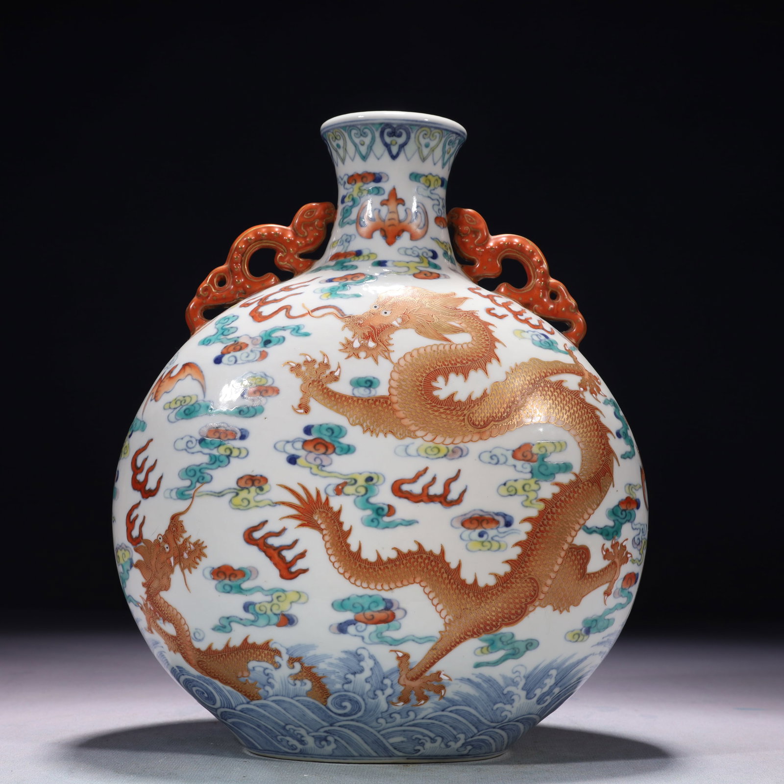 An Exquisite Doucai Iron-Red Auspicious Cloud and Dragon Pattern Double-Ears Vase: An Exquisite Doucai Iron-Red Auspicious Cloud and Dragon Pattern Double-Ears Vase,Qing Dynasty,China,Qianlong Six-character Mark,Size:8.3inx3.9inx10.6in,Weight:2150g 斗彩矾红&#