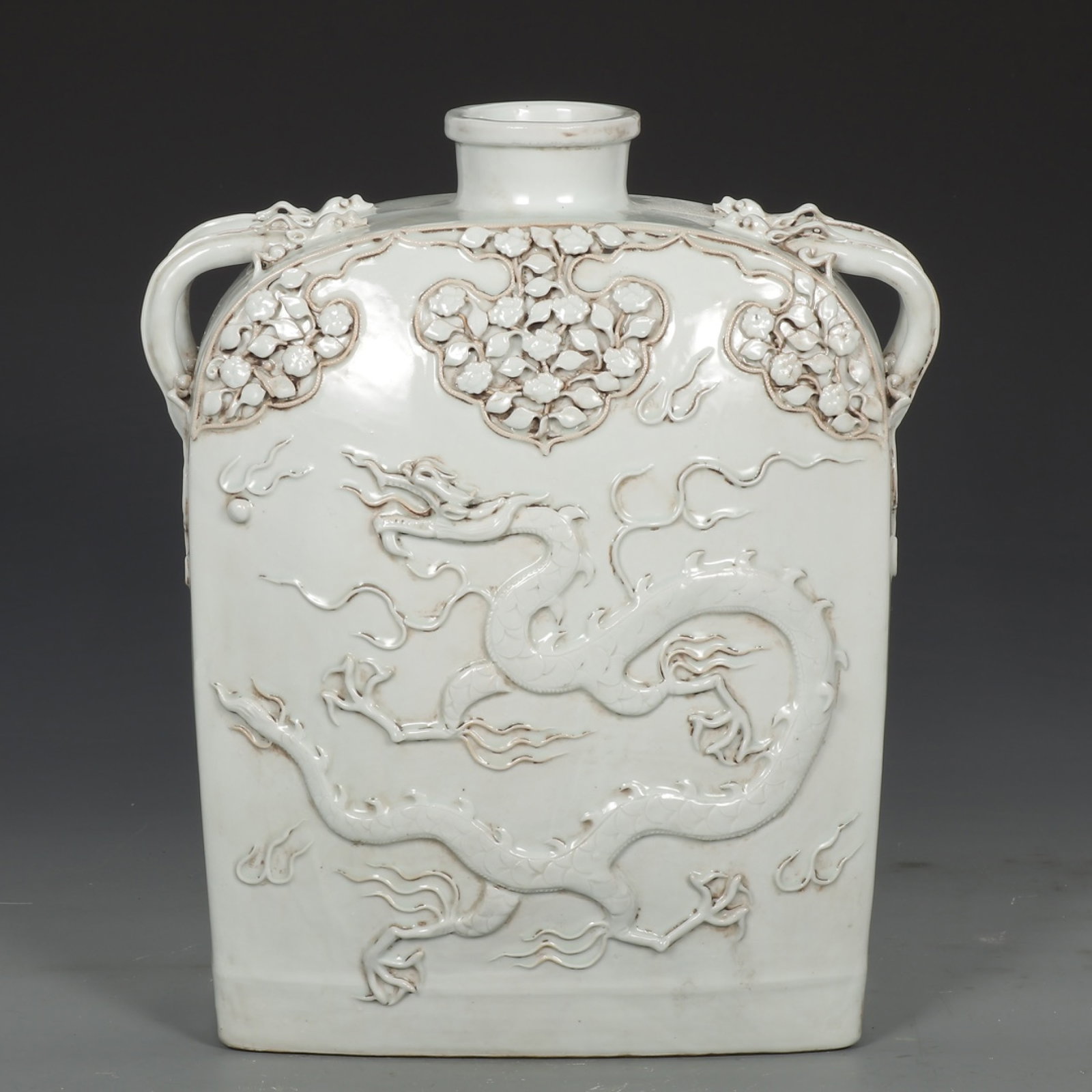 A Huge White Glazed Auspicious Cloud and Dragon Pattern Pot: A Huge White Glazed Auspicious Cloud and Dragon Pattern Pot,Yuan Dynasty,China,Size:15.7inx11.8in 白釉祥云龙纹壶,中国元代