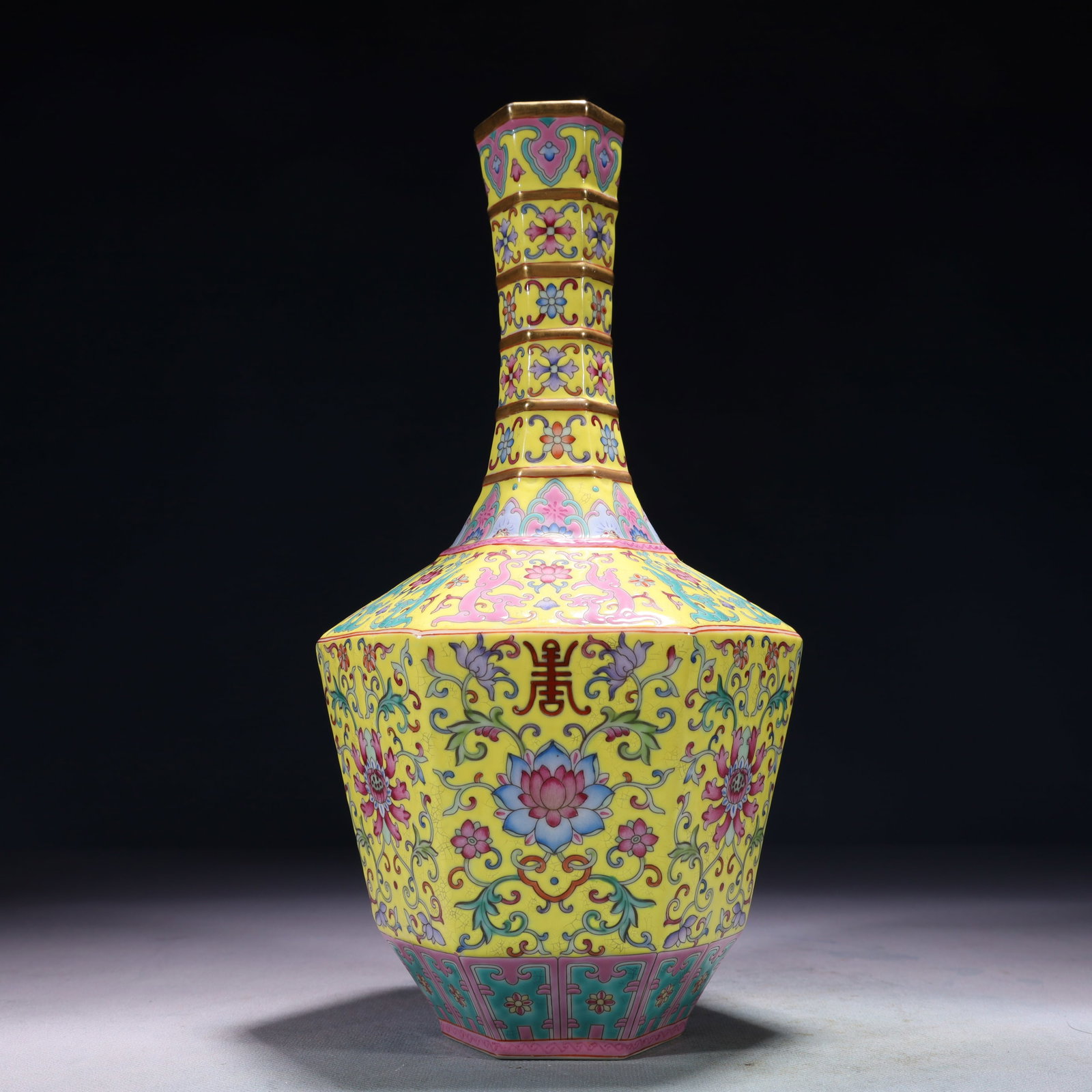 An Exquisite Yellow Ground Famille-Rose Lotus Pattern Vase: An Exquisite Yellow Ground Famille-Rose Lotus Pattern Vase,Qing Dynasty,China,Qianlong Four-character Mark,Size:5.9inx11in,Weight:1100g 黄地粉彩缠枝莲纹