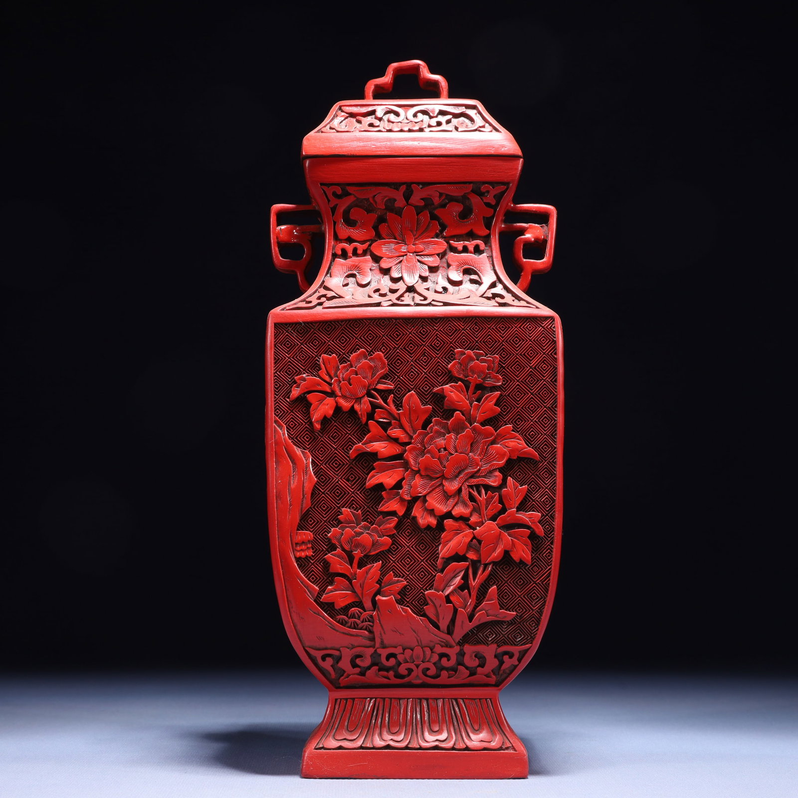 An Exquisite Carved Red Lacquer Flower Pattern Double-Ears Bottle: An Exquisite Carved Red Lacquer Flower Pattern Double-Ears Bottle,Qing Dynasty,China,Qianlong Six-character Mark,Size:4.7inx3.3inx12.2in,Weight:800g 剔红漆花卉纹