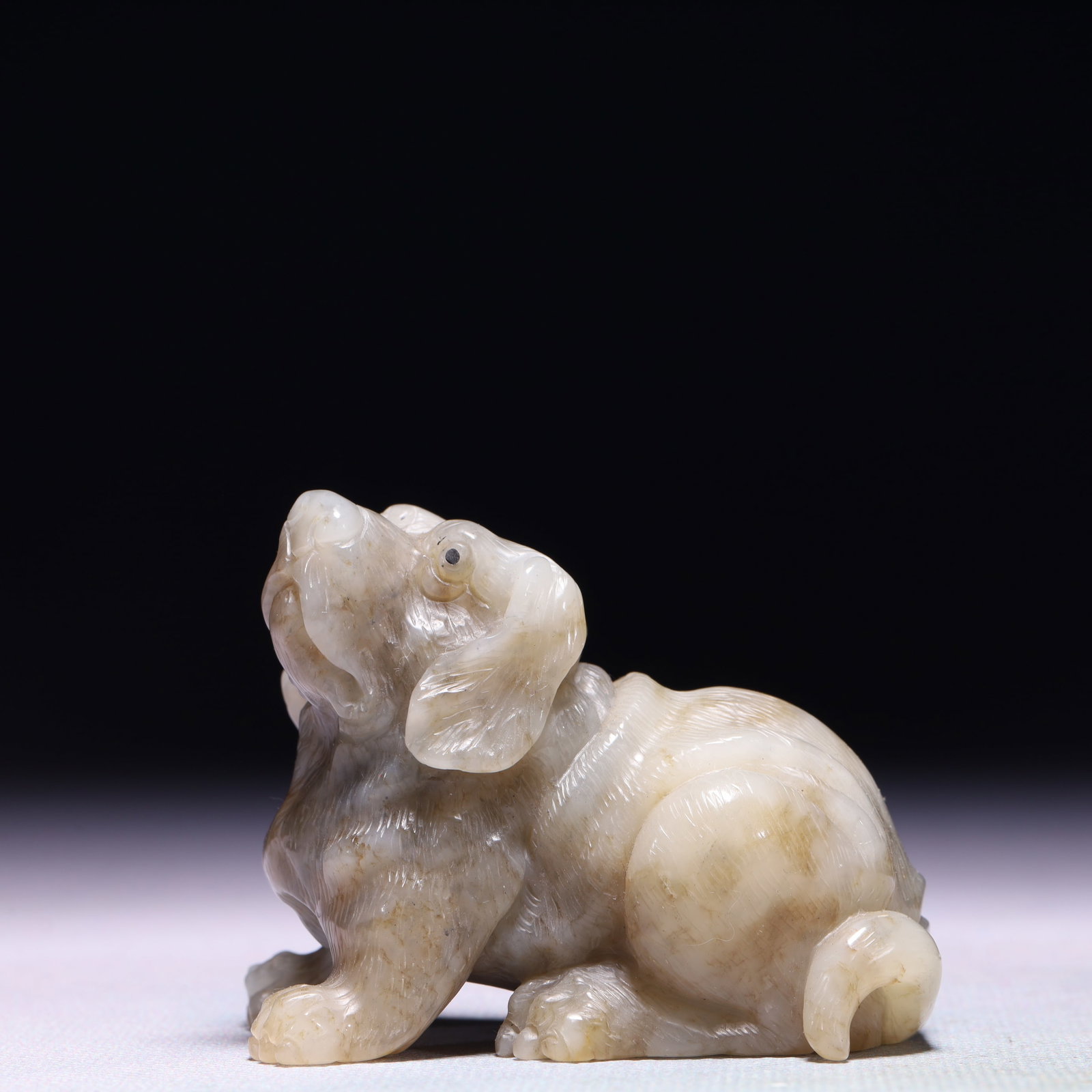 An Exquisite White Jade Dog Ornament: An Exquisite White Jade Dog Ornament,Qing Dynasty,China,Size:2.6inx1.4inx2in,Weight:186.5g 白玉犬摆件,中国清代