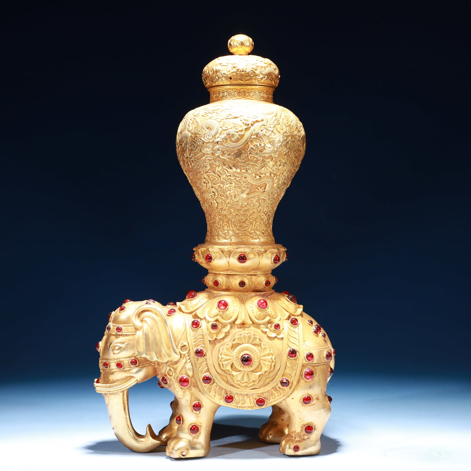 An Exquisite Gilt Bronze Dragon Pattern Elephant Vase,Inlaid Gems: An Exquisite Gilt Bronze Dragon Pattern Elephant Vase,Inlaid Gems,Qing Dynasty,China,Qianlong Four-character Mark,Size:9.1inx3.9inx16.5in,Weight:3350g 铜鎏金龙纹象&