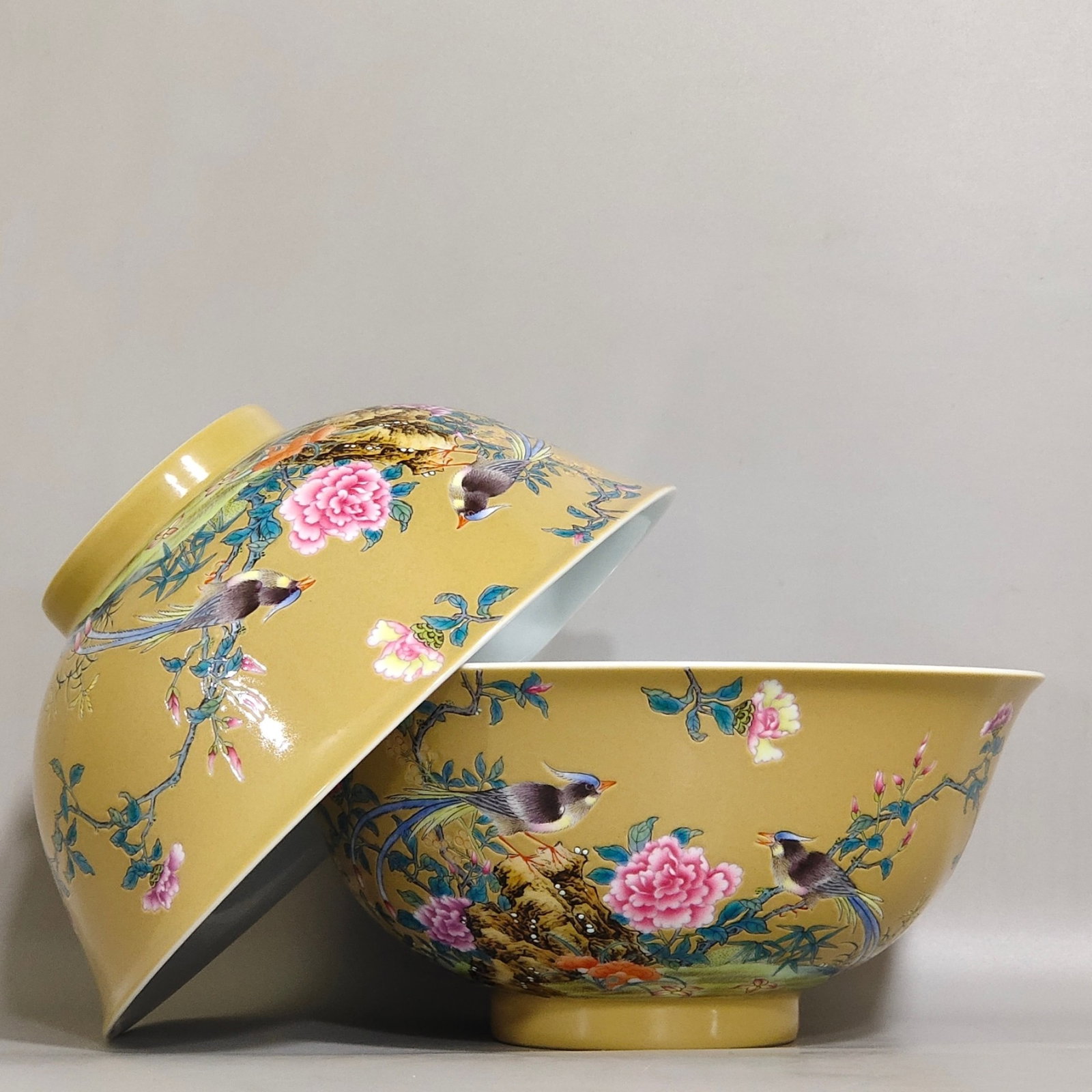 A Pair of Exquisite Yellow Ground Famille-Rose Flower and Bird Pattern Bowls,with poem: A Pair of Exquisite Yellow Ground Famille-Rose Flower and Bird Pattern Bowls,with poem,Qing Dynasty,China,Yongzheng Four-character Mark,Size:3inx6.6in 一对黄地粉彩&
