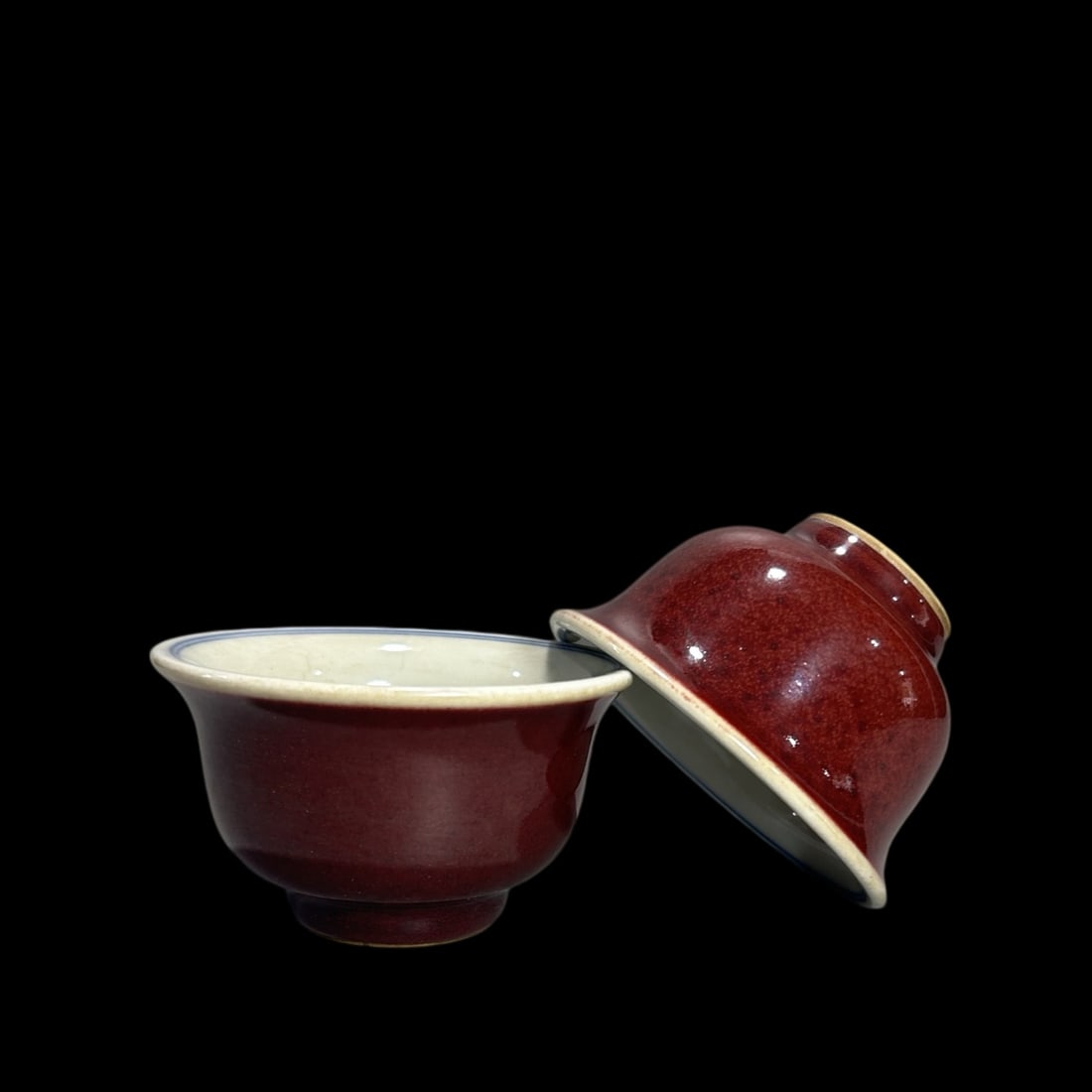 A Pair of Exquisite Ji Red Glazed Blue and White Lotus Pattern Cups: A Pair of Exquisite Ji Red Glazed Blue and White Lotus Pattern Cups,Ming Dynasty,China,Xuande Four-character Mark,Size:2.2inx3.6in