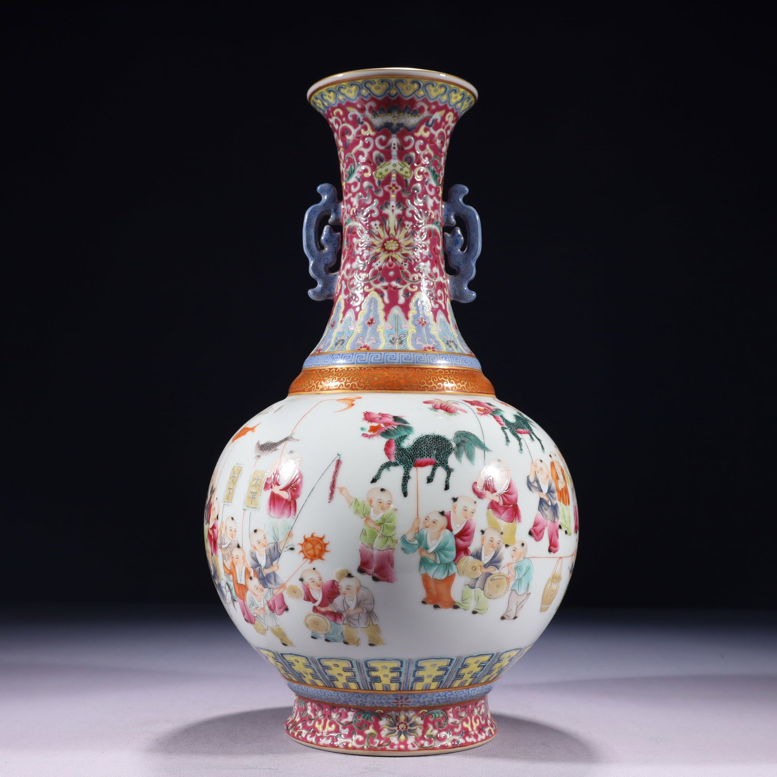 An Exquisite Red Glazed Famille-Rose Painted Gold Character and Story Pattern Double-Ears Vase: An Exquisite Red Glazed Famille-Rose Painted Gold Character and Story Pattern Double-Ears Vase,Qing Dynasty,China,Qianlong Six-character Mark,Size:6.7inx13.8in,Weight:2300g 红釉粉