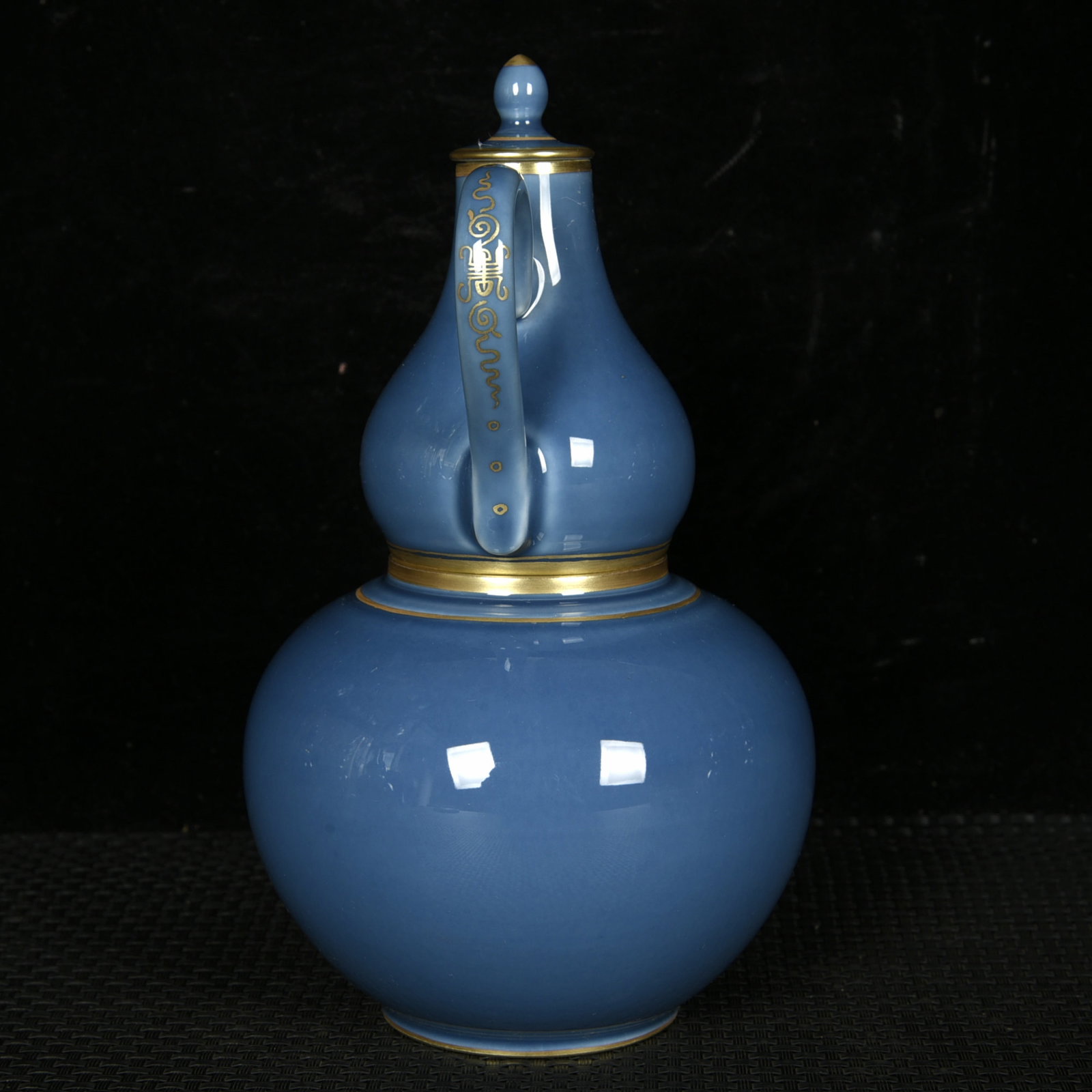 An Exquisite Blue Glazed Gilt Gourd-Shaped Food Vessel: An Exquisite Blue Glazed Gilt Gourd-Shaped Food Vessel,Qing Dynasty,China,Yongzheng Four-character Mark,Size:7.7inx4.3in 蓝釉鎏金葫芦形温酒器