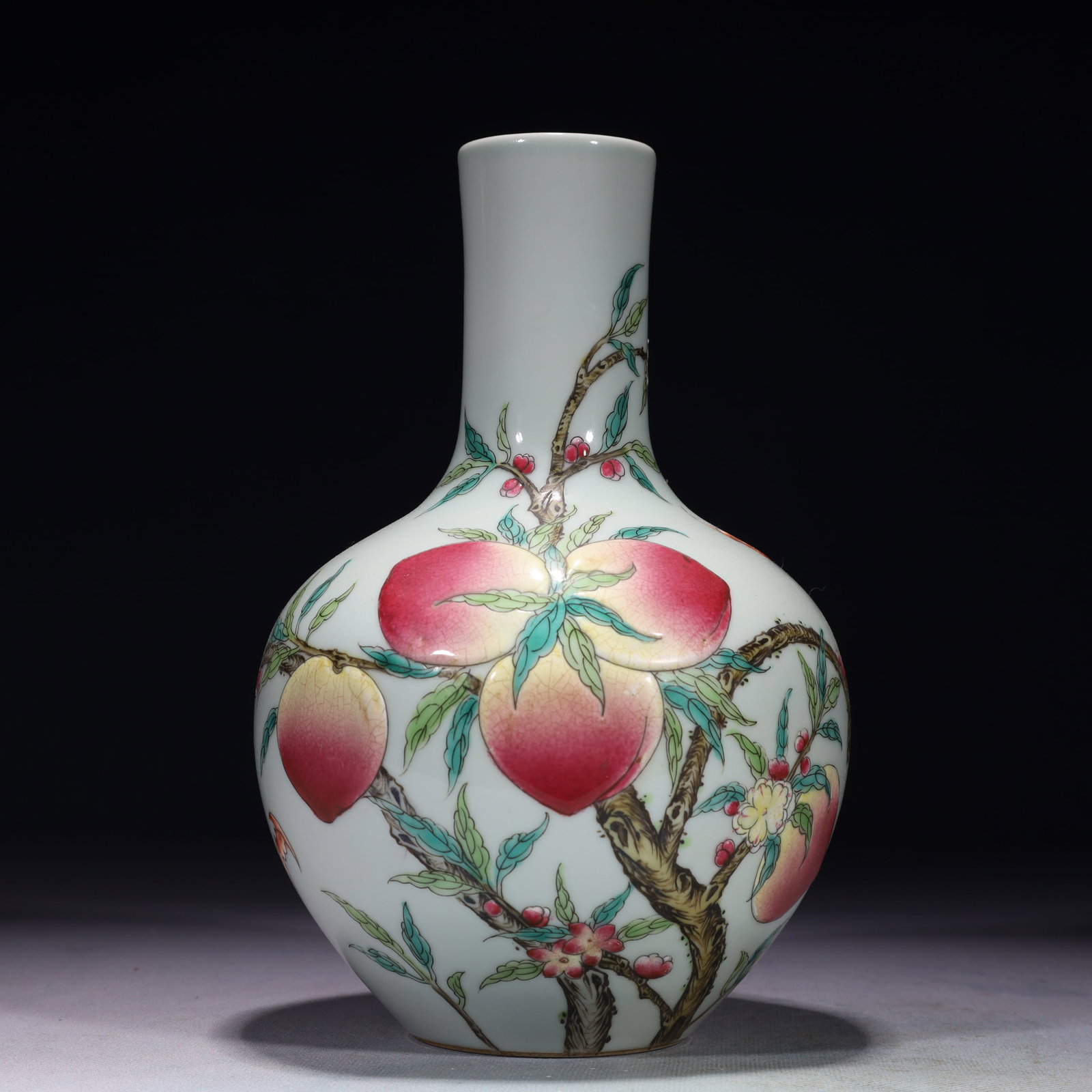 An Exquisite Famille-Rose Bats and Peach Pattern Vase: An Exquisite Famille-Rose Bats and Peach Pattern Vase,Qing Dynasty,China,Qianlong Six-character Mark,Size:5.5inx9.1in,Weight:850g 粉彩蝙蝠桃子纹瓶,È