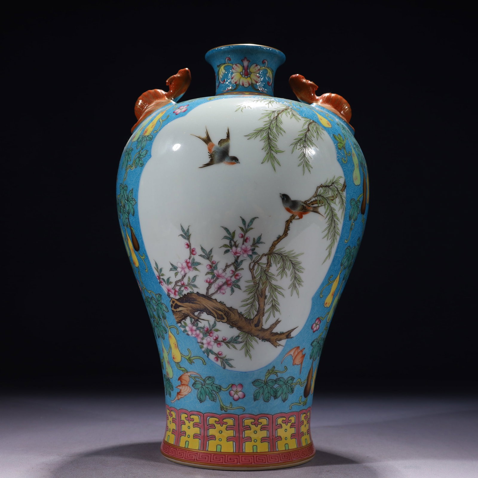 An Exquisite Blue Ground Famille-Rose Painted Gold Flower and Bird Pattern Beast-Ears Vase: An Exquisite Blue Ground Famille-Rose Painted Gold Flower and Bird Pattern Beast-Ears Vase,Qing Dynasty,China,Qianlong Six-character Mark,Size:7.1inx12.6in,Weight:2150g 蓝地粉彩