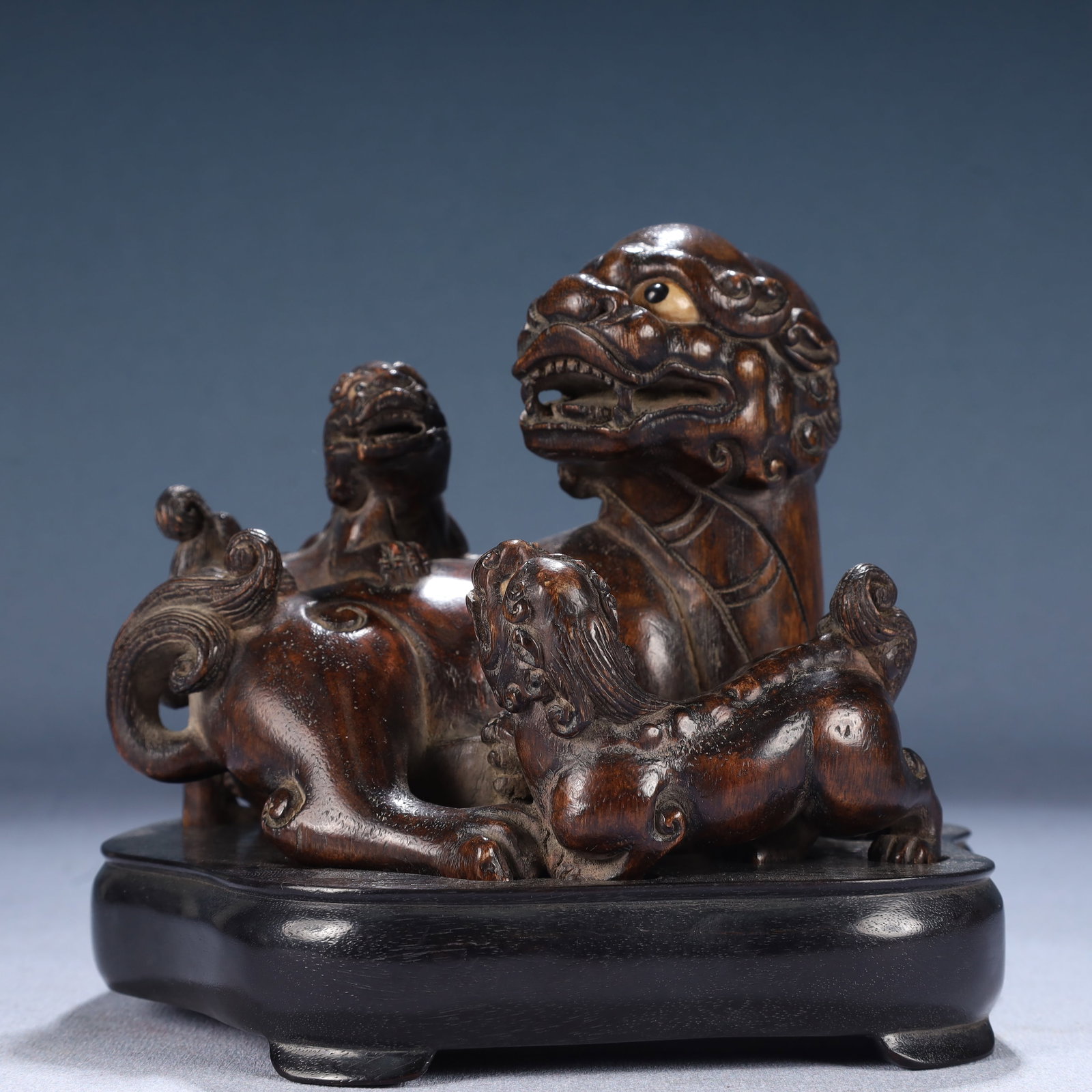 An Exquisite Zitanwood Lion Ornament,With Base: An Exquisite Zitanwood Lion Ornament,With Base,Qing Dynasty, China,Size:5.9inx4.7inx5.5in,Weight:550g 紫檀木狮子摆件,带底座,中国