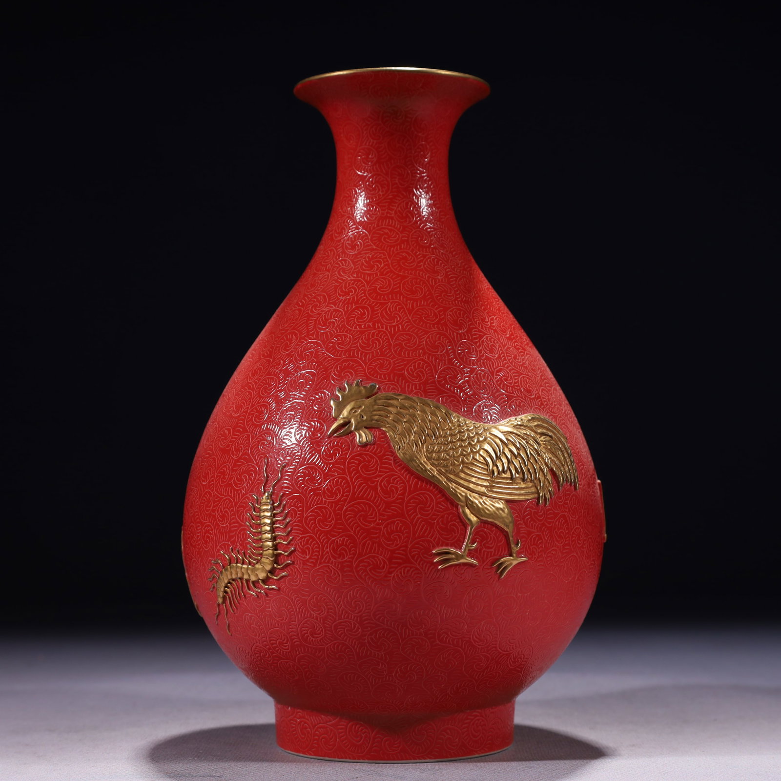 An Exquisite Red Glazed Gold Ground Rooster Pattern Vase: An Exquisite Red Glazed Gold Ground Rooster Pattern Vase,Qing Dynasty,China,Qianlong Six-character Mark,Size:4.7inx8.7in,Weight:900g 红釉金地公鸡纹瓶,&#
