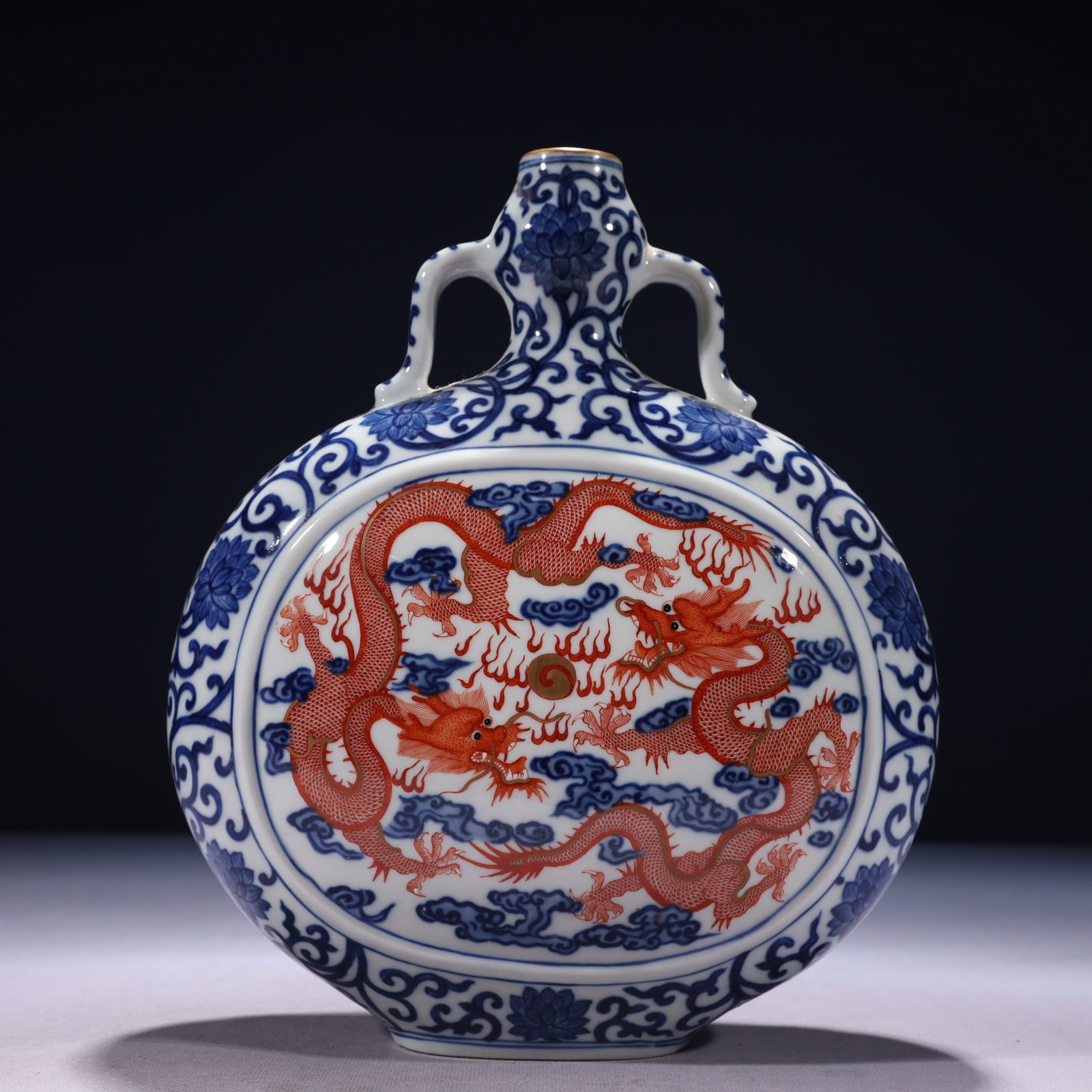 An Exquisite Blue and White Iron-Red Painted Gold Auspicious Cloud and Dragon Pattern Double-Ears: An Exquisite Blue and White Iron-Red Painted Gold Auspicious Cloud and Dragon Pattern Double-Ears Vase,Qing Dynasty,China,Qianlong Six-character Mark,Size:8.7inx3.5inx15in,Weight:1750g 青花