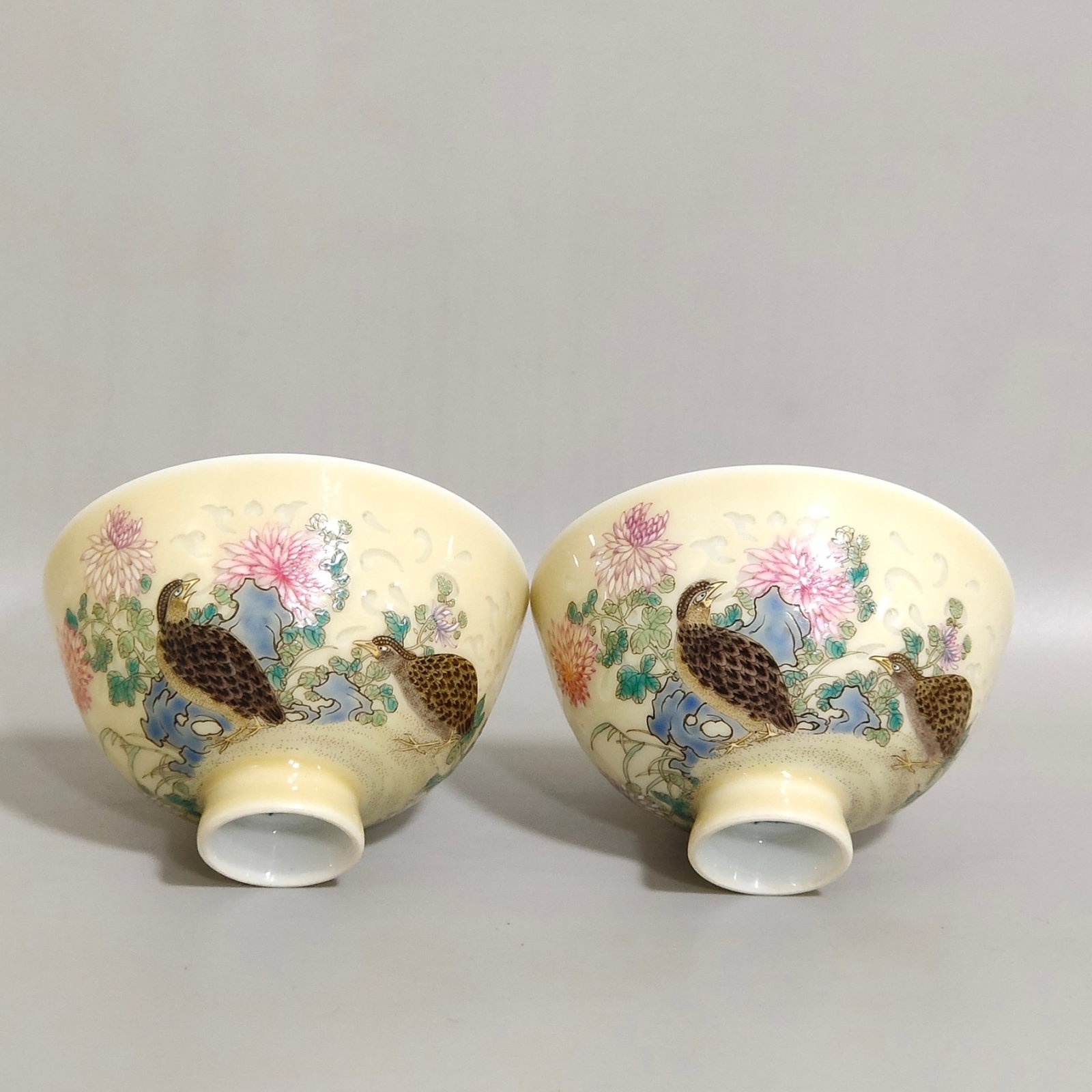 A Pair of Exquisite Yellow Ground Famille-Rose Flower and Bird Pattern Cups,with poem: A Pair of Exquisite Yellow Ground Famille-Rose Flower and Bird Pattern Cups,with poem,Qing Dynasty,China,Yongzheng Four-character Mark,Size:2.8inx1.7in 一对黄地粉彩