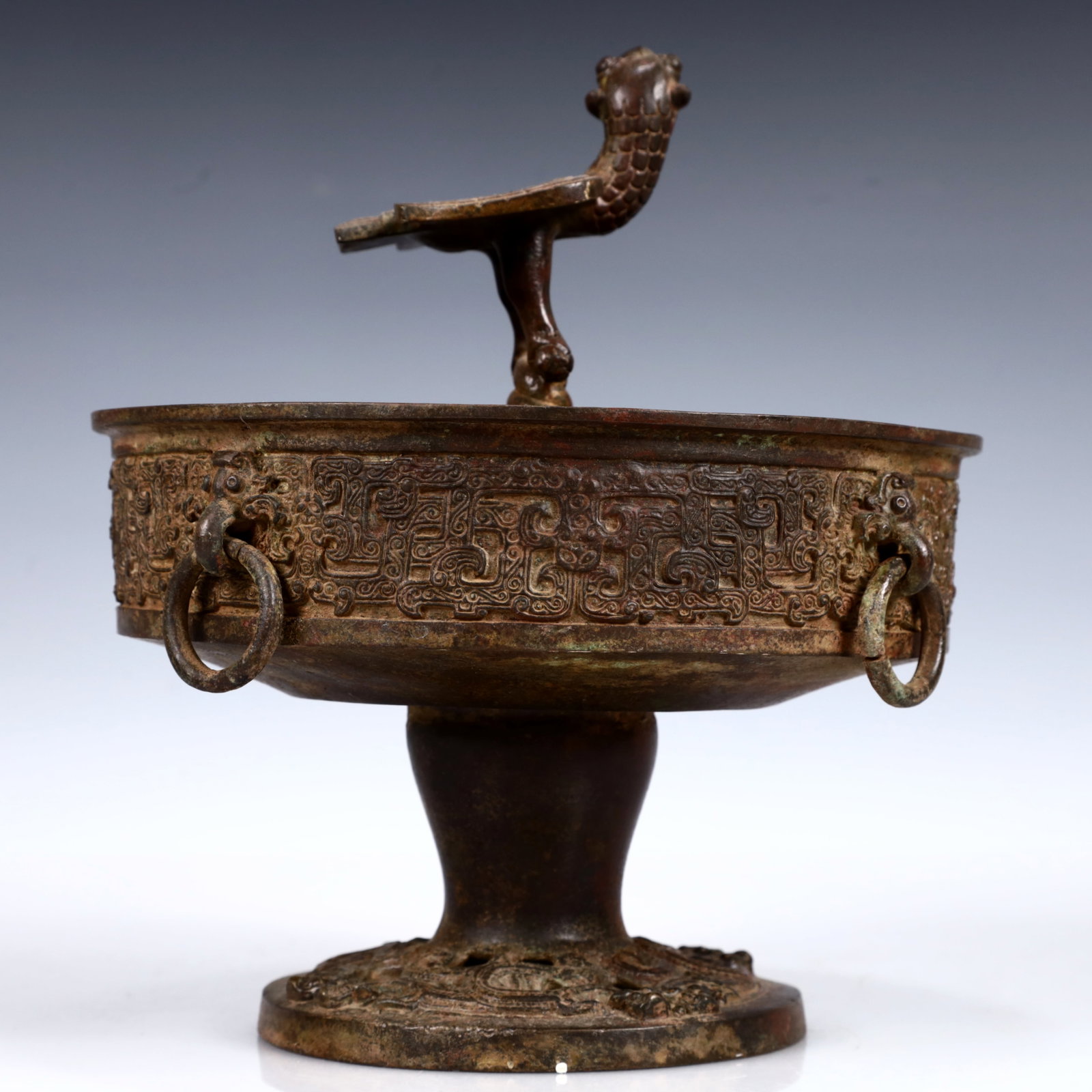 A Rare Bronze Phoenix Plate: A Rare Bronze Phoenix Plate,the Warring States period in China,Size:7.9inx9.1in,Weight:2350g 青铜凤鸟盘,中国战国时期