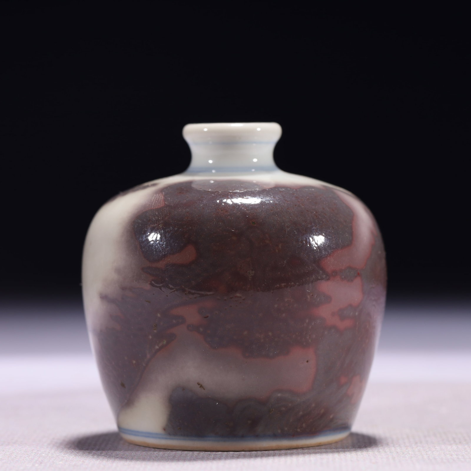 An Exquisite Underglaze-Red Landscape Pattern Snuff Bottle: An Exquisite Underglaze-Red Landscape Pattern Snuff Bottle,Qing Dynasty,China,Kangxi Six-character Mark,Size:2.4inx2.5in,Weight:120g 釉里红山水纹鼻烟