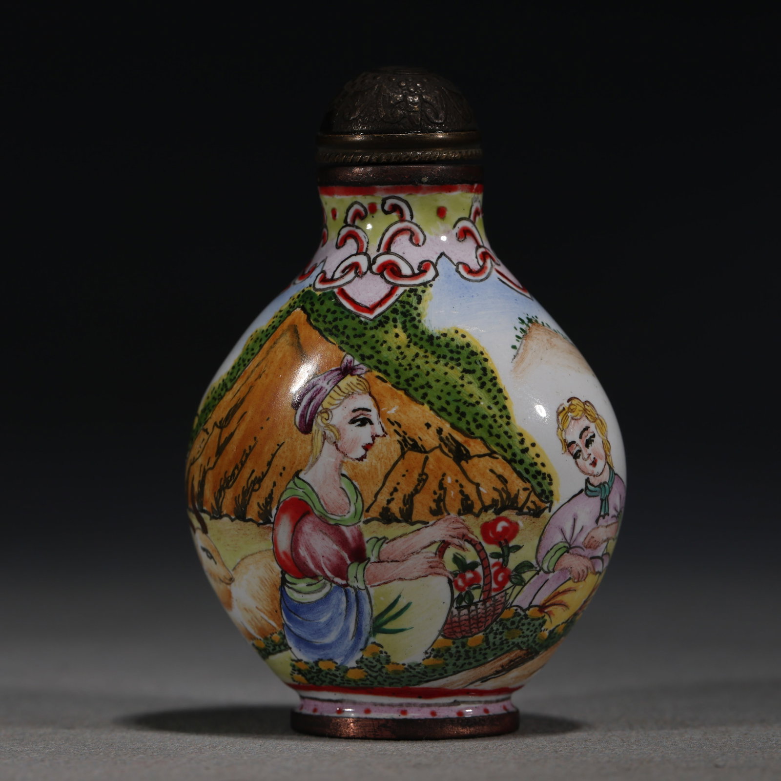 A Chinese Yellow-Ground Painted Enamel Snuff Bottle with Magpies and Prunus,Qianlong Mark: A Chinese yellow-ground painted enamel snuff bottle,densely decorated with magpies perched on blossoming prunus branches.Fitted with a bronze stopper.The base bears a four-character mark reading(Qianl