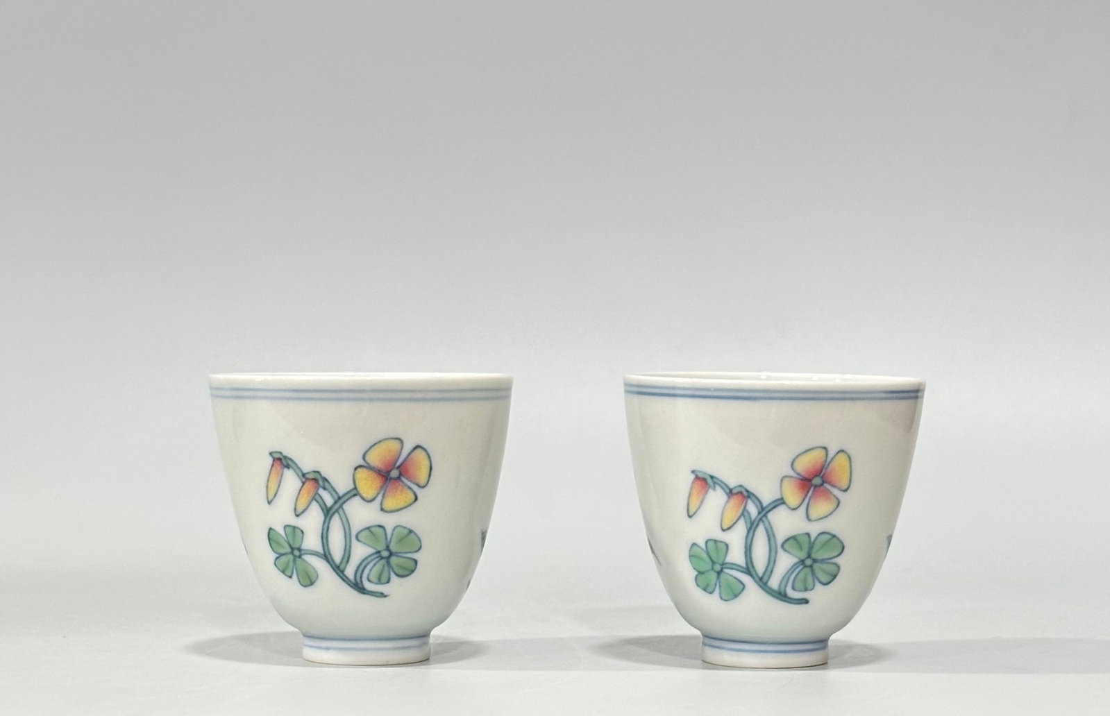 A Pair of Exquisite Blue and White Doucai Flower Pattern Cups: A Pair of Exquisite Blue and White Doucai Flower Pattern Cups,Ming Dynasty,China,Chenghua Six-character Mark,Size:2inx2.2in 一对青花斗彩花卉纹